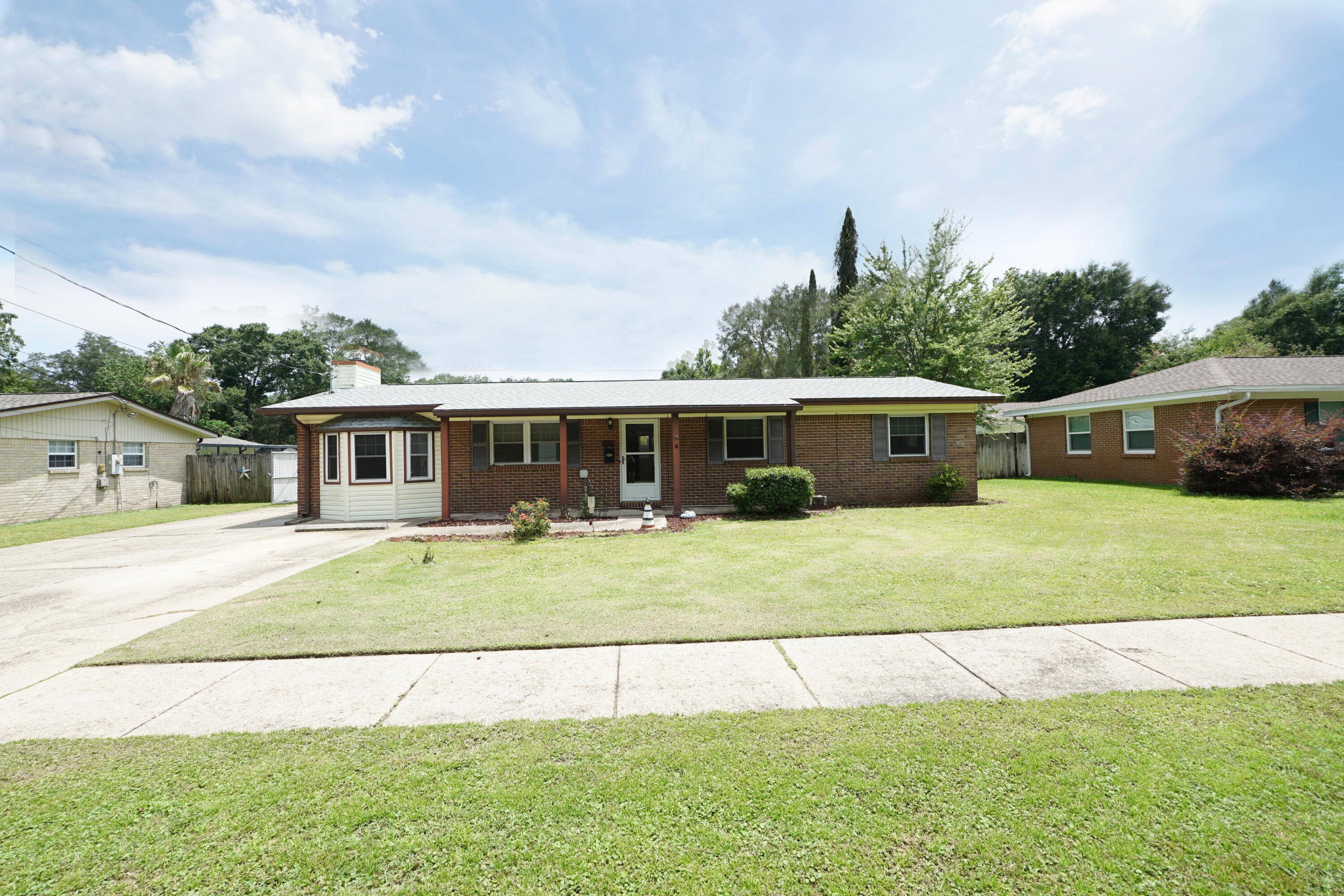 This adorable home won't last long! In the center of Niceville and conveniently located, it will make the perfect starter home or rental. Move-in ready with granite counter tops, stainless steel appliances, and beautiful cabinetry in the kitchen, The den is light and bright, with a warm and inviting wood burning fireplace for the those cold winter evenings. There are three ample sized bedrooms and two full bathrooms with stand-up showers in each. The fully fenced back yard has plenty of space to create a garden, put in a pool, or enjoy cool evenings in the screened Patio. If its storage you are looking for, there is an oversized, detached garage/storage building in the back yard, big enough for all your toys and extras. Come see this cute home and make us an offer!!