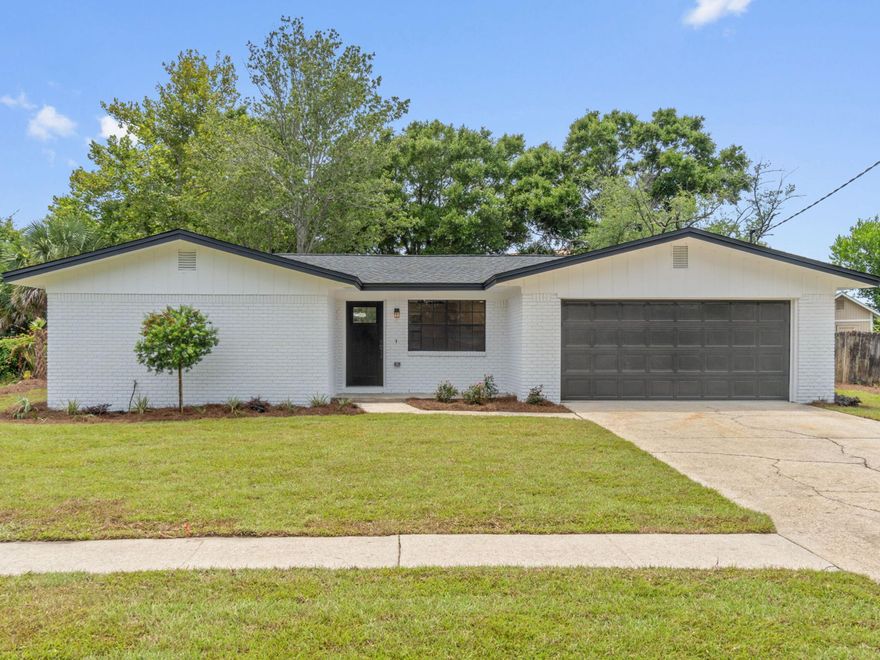 Step into a world of modern coastal luxury with this professionally renovated home, nestled in the heart of Destin. Located on a serene cul-de-sac, this stunning single-story residence boasts a split floor plan, offering both privacy and expansive living spaces. Enjoy a prime location just one block from Destin Harbor, with spectacular views of seasonal fireworks at HarborWalk Village and close proximity to shopping, dining, medical facilities and vibrant city parks with boat ramps. Every detail of this home has been meticulously upgraded, featuring a brand-new roof, copper wiring, and luxury vinyl plank flooring throughout. The stylish kitchen is a chef's dream with quartz countertops, brand-new shaker cabinets, a custom coffee bar, pantry and top-of-the-line GE appliances.
