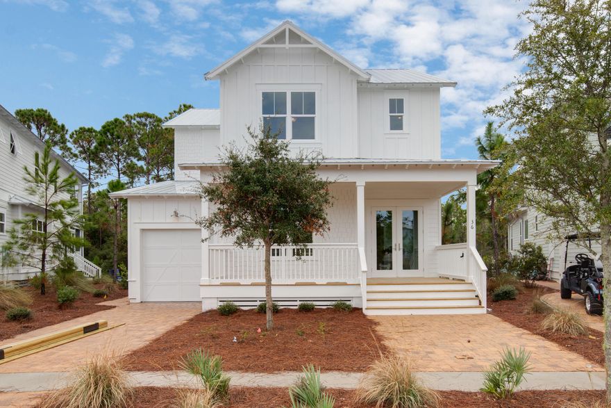 Up to $12,000 in closing cost credit tied to using preferred lender, CTC Mortgage. The Sandcastle plan is completed and move in ready! Rare 3 master suite floor plan! This one has it all- coastal luxury, light finishes and one of the best views in the neighborhood! Front porch overlooks a beautiful pond with frequent duck visitors! Back porch overlooks a pond and preserve= ultimate privacy! Home is also very close to community pool and trail to the beach! 1st floor owner's suite with gorgeous free standing tub, rectangular grey tiled floors and large walk in closet. White exterior with grey interior walls. Kitchen includes white shaker cabinets all the way to the ceiling (glass upper cabinets),