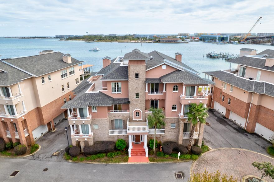 This 3 bedroom 2.5 bath condo offers a prestigious address overlooking Choctaw Bay and Brooks Bridge. Located on the 2nd floor. Elevator available. Master bedroom and Great room walks out to Balcony. Other two bedrooms have a small balcony overlooking front of condos as well. Master bath features double vanities, separate shower and whirlpool tub. Ceramic electric cook top, granite countertops, side-by-side refrigerator and wall oven featured in kitchen. Dining area included in Great room size. Counter top Bar eating as well. Two car garage with 10X11 storage unit. Walk to a number of restaurants, Publix Grocery Store, Banks, Fort Walton Beach Library and Fort Walton Landing Park.  No Pets.  Must call Listing Company to sview.