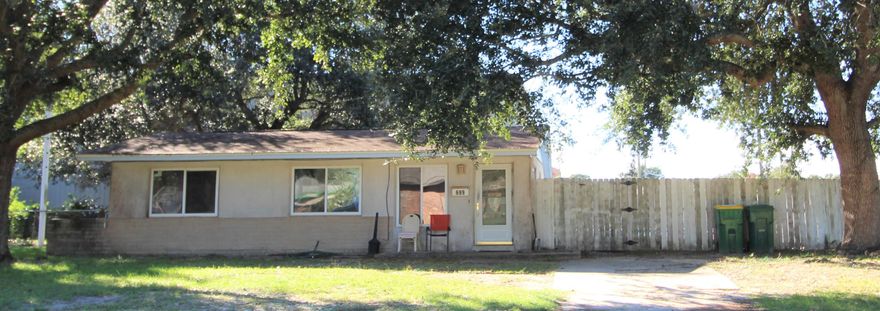 This is a cute Cottage house in the heart of Mary Esther. This home features stainless appliances and lots wooden cabinet spaces.
Beautiful terrazzo floors through out the house. Sparkling salt water pool with deck for your fun times. Corner fenced lot.  Inside laundry room. Short distance from tons of shopping areas, Hurlburt AFB and many restaurants. This home need a little TLC and sold 'AS IS' condition. Refrigeration, washer and dryer does not convey. Please 'Cash only'!