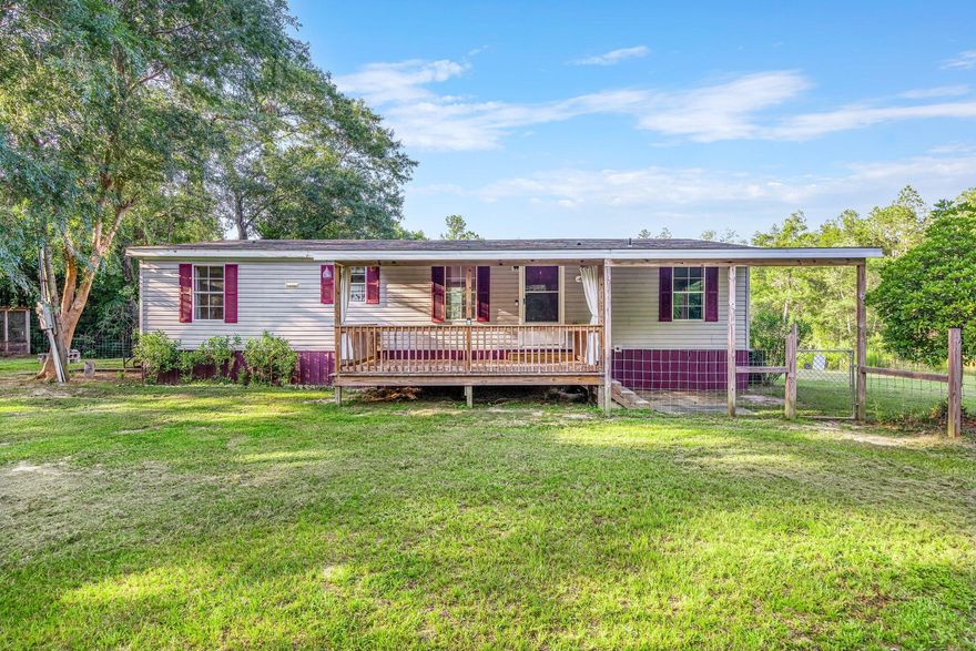 Bring your fishing poles and smores! This peacefully situated 3 bedroom 2 bath manufactured home of 1,323 sqft rests on a 5.86 acre lot and is just minutes away from Blackwater River. A covered front patio to hang out on and plenty of yard for kids, pets, and a campfire. The expansive backyard includes a ''predator proof'' chicken coop plus Bull Pen Branch creek running through! Come enjoy the quiet country living and wooded views!