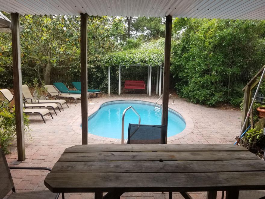 Beautiful brick home on large lot with plenty of parking in quite neighborhood
and a five minute walk to county gulf front park.

This is a very well kept selective rental managed by the owner doing 50,000.
a year. Private pool with a large back yard.
Master bath ,bedroom, kitchen and large great room are on the 1st floor
for those looking for a retirement home
close to the gulf.