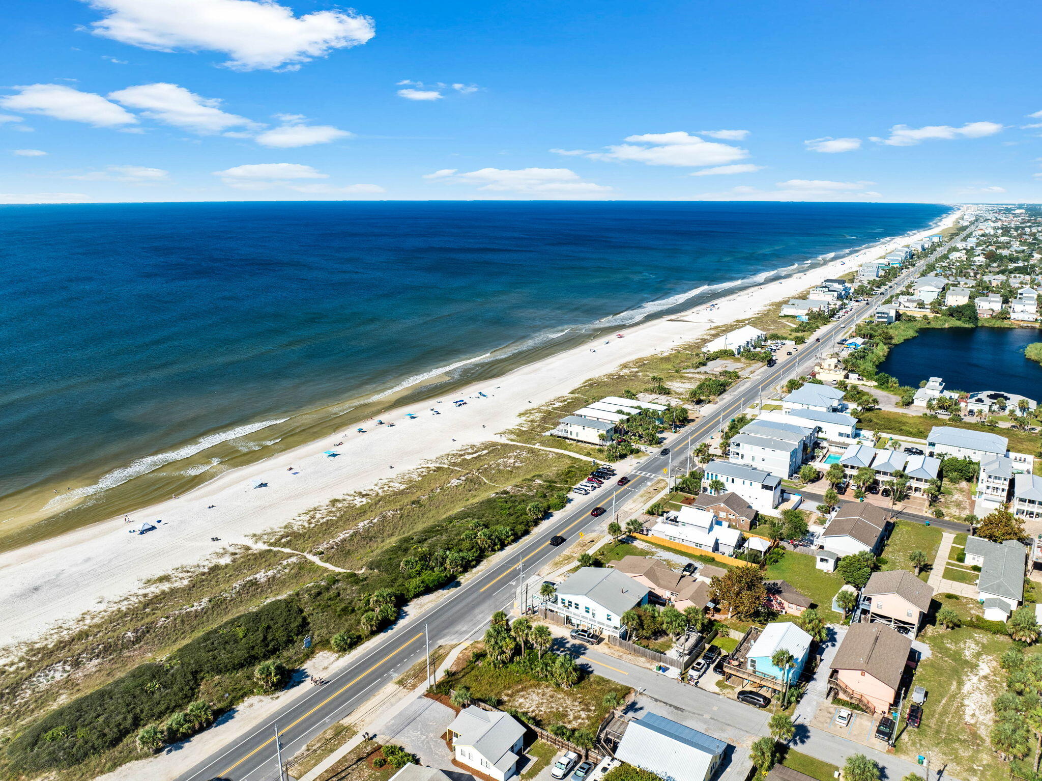 Build Your Dream Beach Home at 315 La Paloma Place - A Prime Location in Growing Panama City Beach!This vacant lot at 315 La Paloma Place is a rare find in the rapidly expanding Panama City Beach area. Situated just a short golf cart ride (approx. 3 minutes) to two beach accesses--Beach Access 76A and Beach Access 77, you'll be enjoying the pristine, white sands and emerald waters in no time!In addition to being close to the beach, this property is located in a thriving area with exciting new developments and pre-developments on the horizon, such as Latitude Margaritaville Watersound and RiverCamps on Crooked Creek. These upscale communities are drawing new residents and investors, further fueling the economic growth of the area. 
In addition to being close to the beach, this property is located in Panama City Beach is experiencing unprecedented expansion, with a projected 14.3% population increase over the next 5 years, driven by the appeal of the coastal lifestyle and new job opportunities.
Panama City Beach's tourism and real estate markets continue to be the primary drivers of economic growth, bolstered by $2.5 billion in annual tourism revenue and record-breaking numbers of visitors year after year. Plus, the area's strategic location near Northwest Florida Beaches International Airport (ECP)just 20 minutes awaymakes it an easy destination for travelers, vacationers, and potential renters, providing additional long-term investment potential.
Laguna Beach, just minutes from the lot, is quickly growing into a sought-after beach community, with new commercial and residential developments springing up. You're also a short drive from Inlet Beach, where high-end homes, boutiques, and dining along 30A make it one of the most desirable areas on the Gulf Coast. This lot puts you at the epicenter of it all.

Important infrastructure is already in placewater tap fees have been paid, and electric and cable are nearby, saving you time and effort as you plan your dream home or investment property.

With the combination of location, growth potential, and convenience, 315 La Paloma Place is an ideal property for those looking to build and capitalize on the growth of Panama City Beach. Don't miss out on this opportunity to be part of the area's exciting future!
