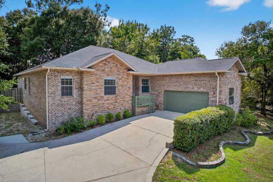 UNDER CONTRACT WITH KICKOUT CLAUSE. The full brick exterior offers timeless curb appeal, while inside you'll find 4 bedrooms, 2 baths, and a spacious layout designed for comfort.Two large living areas share a look-through gas fireplace, and a cozy study nook adds flexibility. The master suite features double vanities, a stand-up shower, and a garden soaker tub. Extras include a laundry room with washer/dryer, a 2-car garage with extended ceilings.Perfectly located across from Blackwater Golf Club, with a community park and school bus pickup out front, plus quick access to I-10 and shopping. A transferable VIP membership with We Care Heating, Cooling, Plumbing & Electric adds peace of mind.