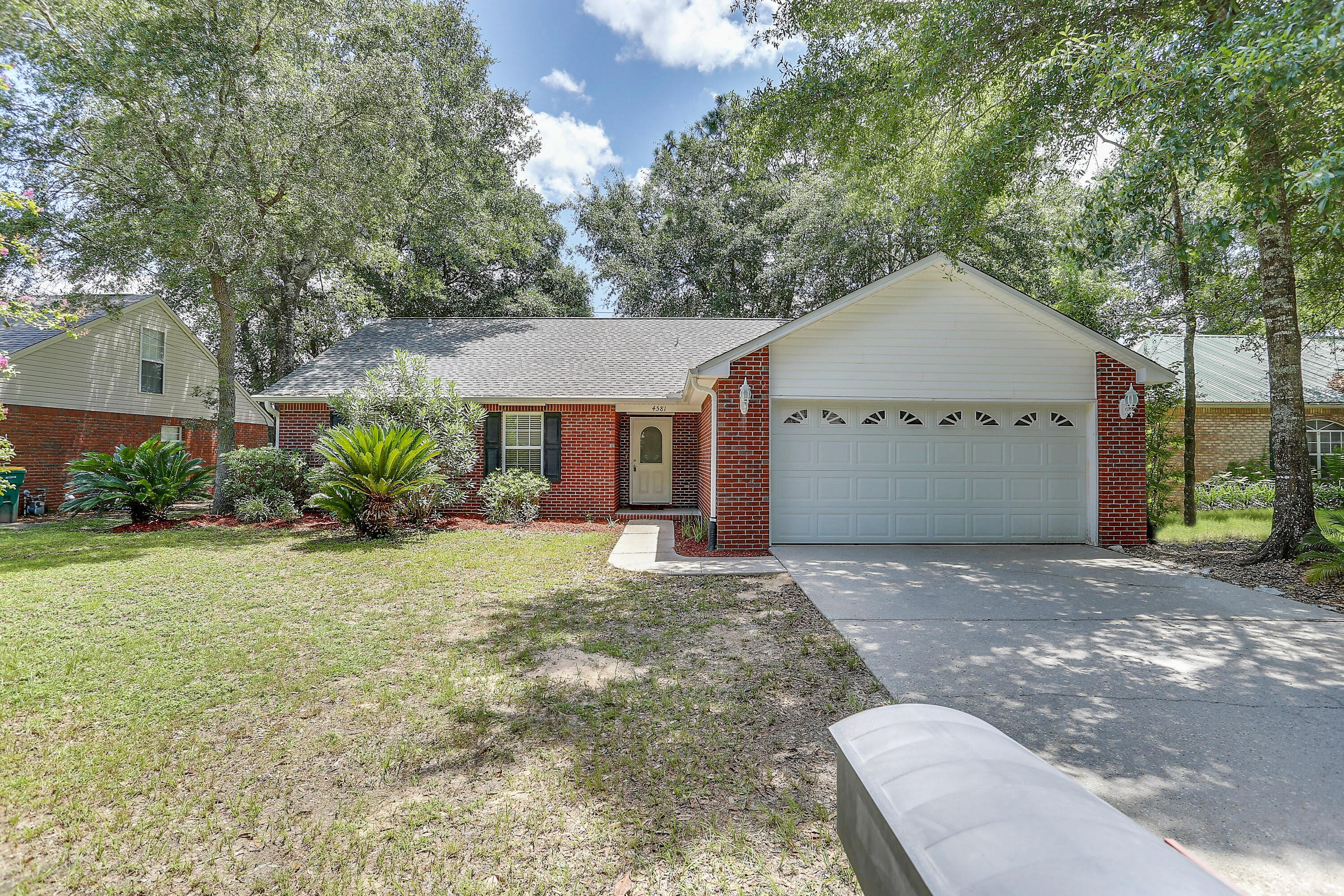 Come enjoy this well maintained 4 bedroom/2bath/2 car garage home nestled in the sought after subdivision of Pinnacle Point located South of I-10. The home welcomes family and friends alike with cathedral ceilings in the family room accented with a fireplace and has access to the large Florida Room perfect for entertaining. The kitchen features white cabinets, attractive granite counters and undermount sink, and large pantry. The master suite features a walk in closet, dual vanities, new vinyl plank flooring in master bath. The home features a split bedroom design and the additional bedrooms are nice sized and have ample closet space. The roof and water heater were replaced in 2021 and the HVAC was replaced Sept 2017. Schedule your private showing today!