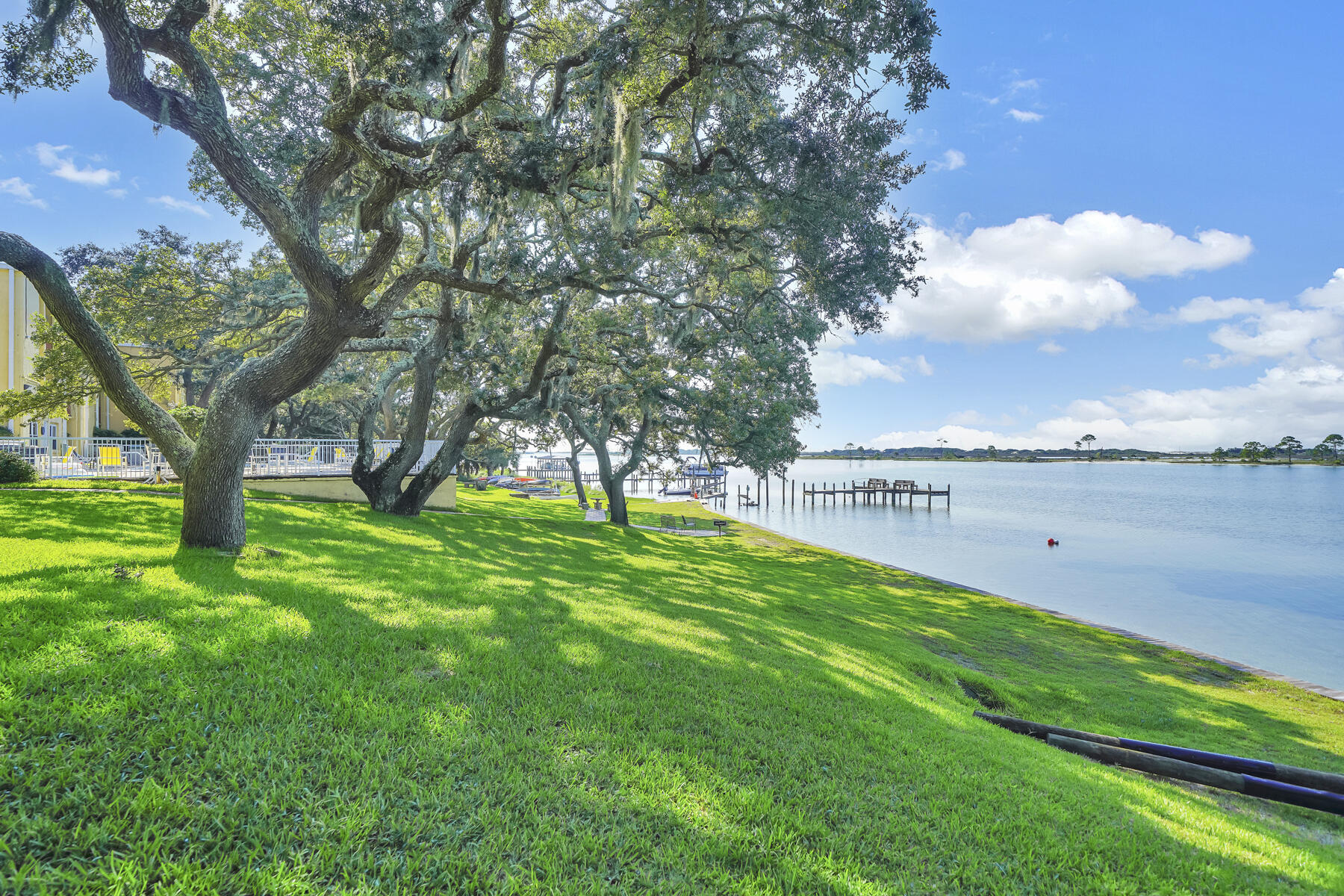 Discover the potential of this one-bedroom, one-bath condo in the Sound front community of the Cedars Condominium Complex. This unit is a blank canvas, ready for you to customize with your tastes and preferences. The complex offers a range of amenities, including a waterfront pool, a pool house for entertaining, a community clubhouse, a private beach, and a dock perfect for fishing, enjoying stunning views, or launching out to the nearby Islands in the Sound. Additional features include free kayak racks and an on-site laundry area. Whether you're looking for a primary residence or a savvy rental investment where short term rentals are permitted, this property is an excellent choice. Conveniently located just east of Hurlburt Field and within close proximity to Eglin AFB, shopping, dining, Crab Island, Destin, white sand beaches, and world-class fishing, you'll have easy access to everything the Emerald Coast has to offer. Schedule your appointment to preview today! Buyer to verify all dimensions.