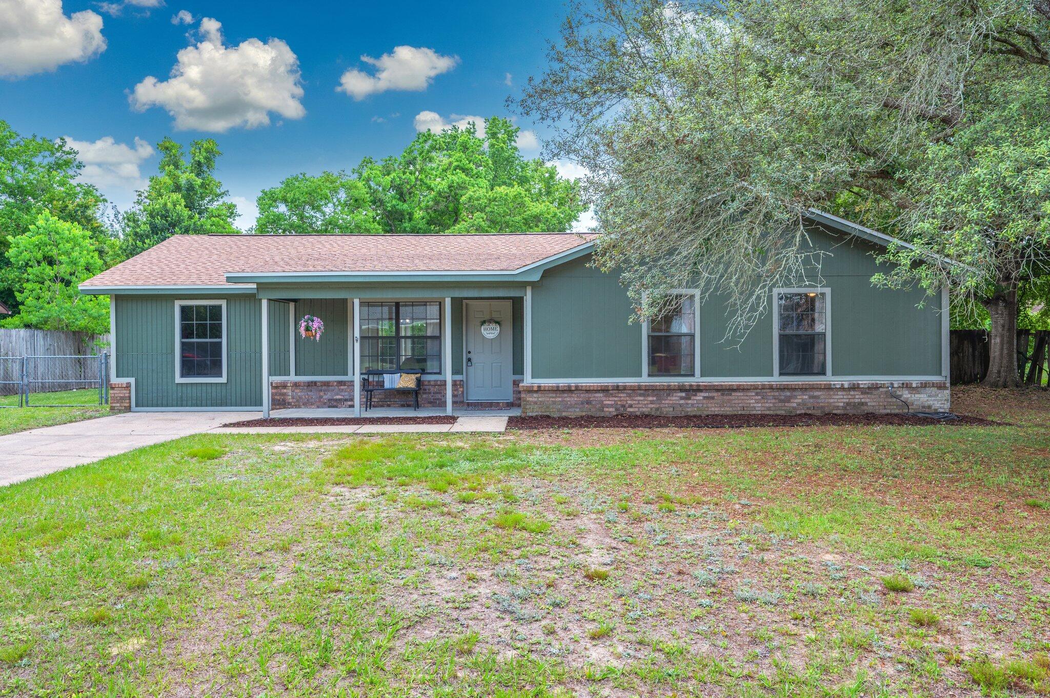 This home is ready for new owners. Roof and water heater new in '21. HVAC just gone through and given a seal of approval. Large lot on the south end of town, one stoplight and you're out of town! Beautiful tile in the main living areas and carpet in the bedrooms. Gorgeous butcher block countertops. This 4/2 is affordable and ready for you!