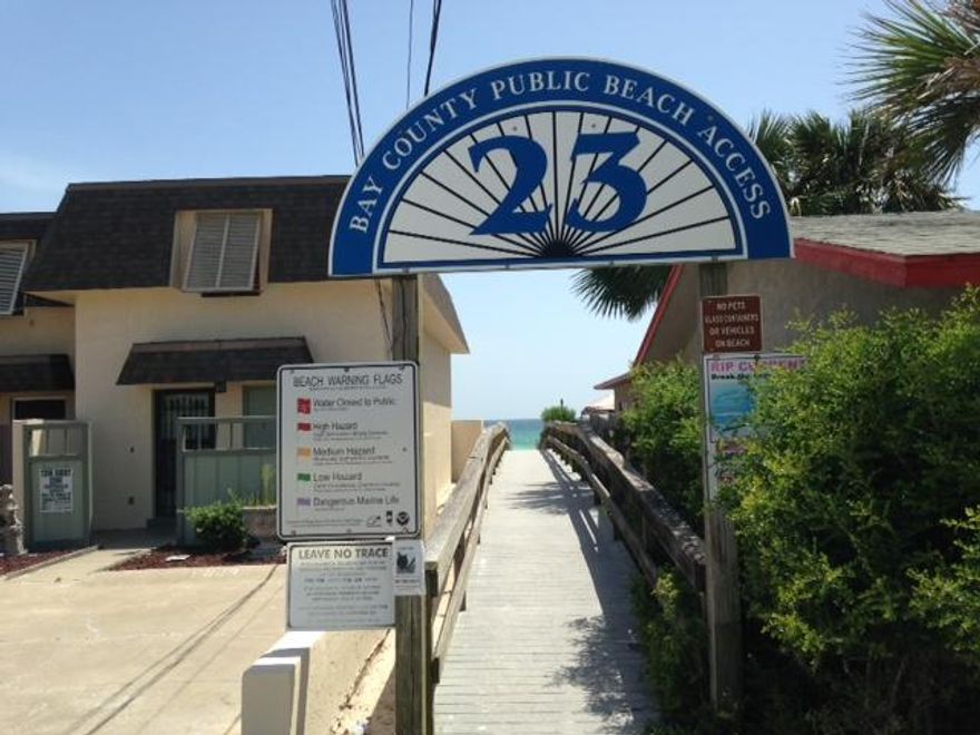 REDUCED! Income producing Property or purchase to live in yourself and enjoy year round living on the beach! This attached single family unit has Gulf Views and a Beach access directly across the street. Investors this property brought in 26K in just the Spring and Summer months last year. Enjoy the Gulf view from the living room or step out on the deck and watch the sunset. This unit has two large bedrooms with two full bathrooms plus a bunk room and laundry room downstairs. Upstairs is the kitchen, living room and partially covered patio with Gulf views. An outside shower is located conveniently near the front entrance. A garage can house 1 car and hold your beach items! There is a privacy fenced backyard. Seller is offering $5000 towards closing costs with an acceptable offer. No HOA!