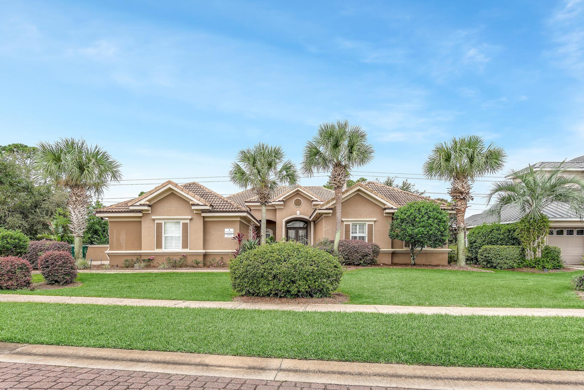 Exceptional opportunity abounds with this gorgeous 3,454 sqft, 5 bedroom rental machine ideally located on Scenic Highway 98 within the beachside gated community of Destiny East.  This rental magnet abounds with over $140,000 + YTD gross annual rental income and availability for additional bookings. Surrounded by a natural greenbelt and walking paths, providing a sense of privacy and seclusion, yet close proximity to the lakefront community pool and beach access. Offering an exemplary private pool located in the front courtyard, spacious screened in porch located in the backyard, an open floor plan with two master suites, and two separate living areas. Notable features include plantation shutters, trey ceilings, triple crown molding, gas stove, and a 2.5 car garage (golf cart