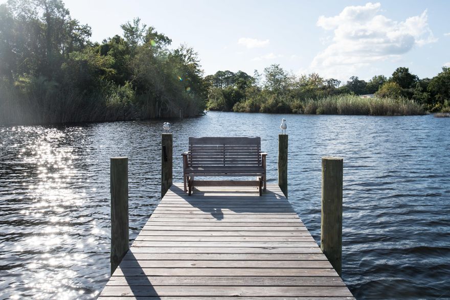 Check out this affordable waterfront townhome in a gated community. Endless sunrises and sunsets over Cinco Bayou. Paddle boarding on the smooth waters, or kayaking down to the bay or better yet get your boat and go to Crab Island for the day. And by the way this is high and dry. The HOA is only $285 a quarter and boat slips are on a first come basis but currently all slips are available. In the past several years a new seawall has been installed, dock has been refurbished, a new roof installed, new gutters, and fresh paint on the outside. The deck on the unit is made of composite material as well. New updates to the kitchens and bathrooms on the inside. With beautiful tongue and groove pine accents. New lighting in all the rooms. Start living your dream today!