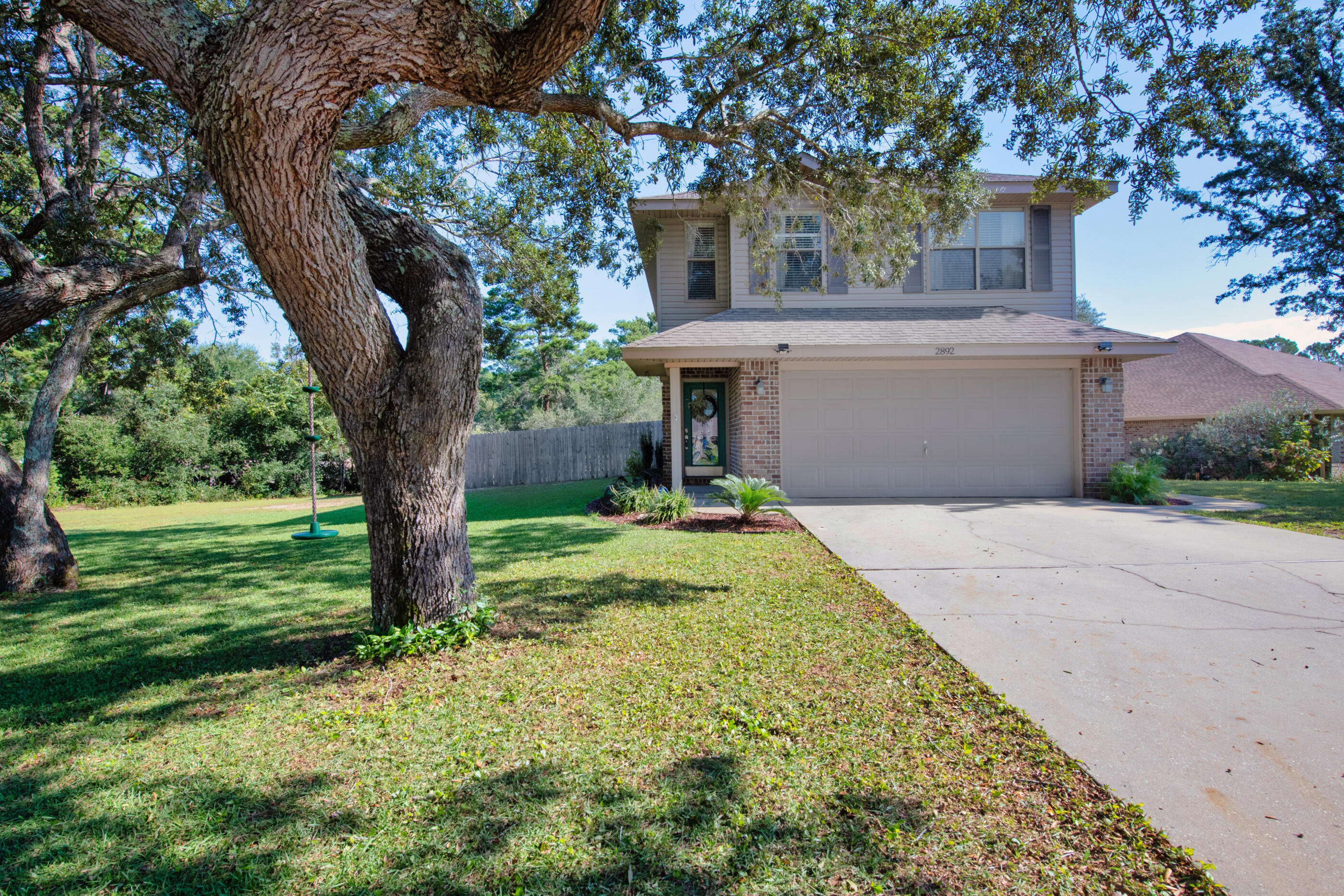 This impeccably maintained 4 bed, 2.5 bath home in the desirable Waterstone subdivision of Navarre is now even more enticing. With the HOA permitting boat storage, this home offers the perfect coastal lifestyle.Situated on a spacious 1/2 acre lot, this former model home welcomes you with an inviting entry hall that opens to a bright and airy living/dining area. Natural light pours in through four large windows, highlighting the luxury vinyl plank (LVP) flooring throughout the lower level. The kitchen is a chef's delight, featuring stainless steel appliances, Cherry cabinets, a tile backsplash, and a pantry for ample storage. The first floor also includes a convenient powder room and a 2-car garage with durable Epoxy floors. Upstairs, you'll find four generously sized bedrooms, two full baths, and a laundry room for added convenience.
Enjoy the outdoors in your expansive, fenced backyard, complete with well irrigation for easy maintenance. With just a 15-minute drive to Navarre Beach and easy access to Pensacola and local military bases, this home offers the perfect blend of tranquility and convenience. Don't miss this opportunity!