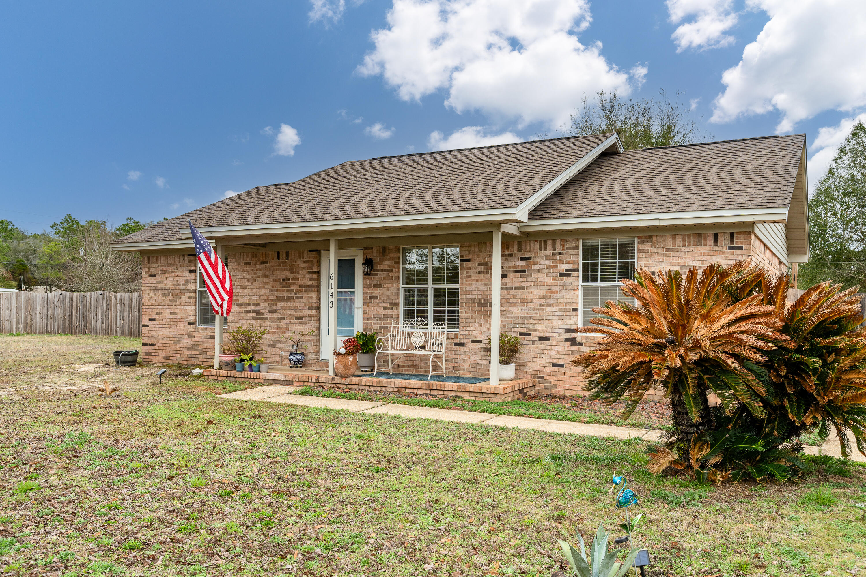 This charming residence is situated in the delightful Whispering Lakes Estates in Crestview. No HOA, Private Lake access! Sitting on a 1.01 acre cleared lot, it boasts a freshly constructed patio featuring a fire pit and a hot tub for unwinding. A recent addition of a privacy fence in the front portion of the backyard enhances the property. The remaining backyard is enclosed by a chain link fence providing ample space for children to play or pets to freely wander. Upgrades are abundant throughout the house, upgraded electrical panel, roof 2018, updated kitchen hardware, modern light fixtures, new cabinets in the laundry room, and a new washing machine which will be included in the sale. Seize the opportunity to transform this outstanding property into your own.