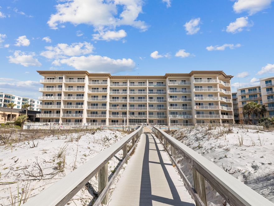 Enjoying an enviable location on Okaloosa Island, this first-floor condo has gulf views from the living room, terrace and master bedroom. It also boasts a private gate leading directly to two pools, a BBQ area and a beach walkover. Extra windows in this corner unit create a bright living space for relaxing together after a fun-filled day at the beach, pool and nearby attractions. Tile floors and fresh decor enhance the spacious open living room, which includes sofa seating, a dining table and a breakfast bar. The fully equipped kitchen has white appliances, black granite countertops and a pantry for extra storage. Three bedrooms include a king-sized master suite and a bunk room that will thrill youngsters. With two full bathrooms, the unit can easily accommodate nine guest