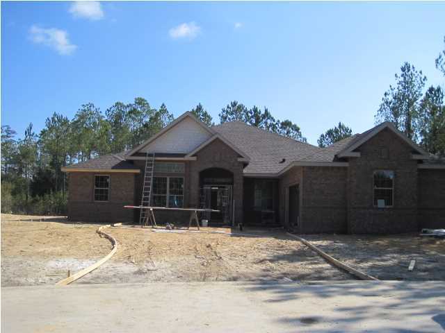 Beautiful, brand new brick home with many luxury design features. 4-side brick construction, volume ceilings add incredible drama to great room, 42'' raised panel cabinets with granite in kitchen/baths. Low density neighborhood with heavily wooded/private oversized homesites.