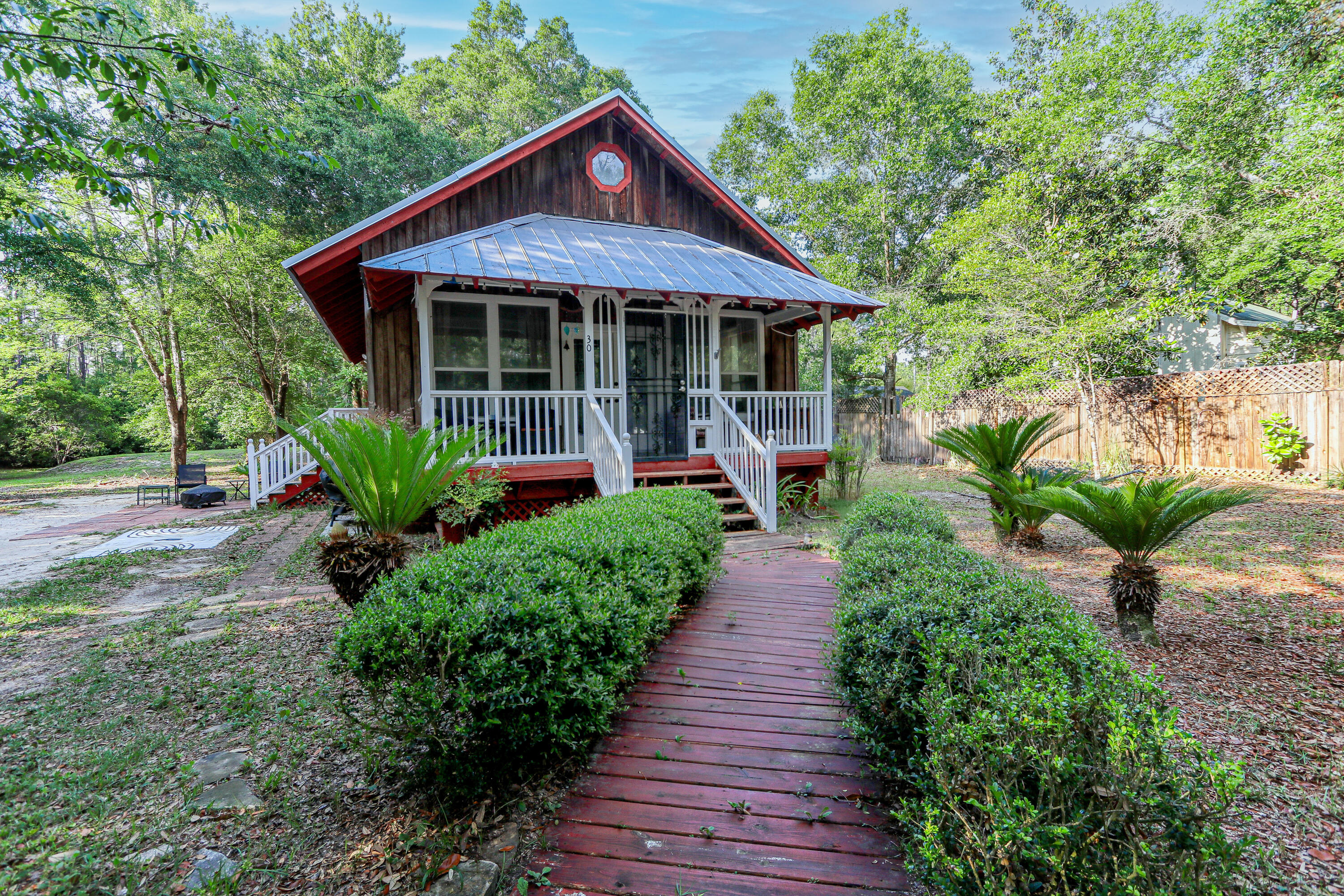 Welcome to 30 Creekside Waterview Place, a beautifully updated 2-bedroom, 2-bath A-frame cabin nestled on a fully fenced 0.58-acre lot in Freeport. Located just 15 minutes from the white sandy beaches of 30A, this home offers peaceful living with convenient access to outdoor adventures.This inviting property has seen extensive upgrades, including a new roof, spray foam insulation, septic system, PEX plumbing, water heater, and commercial-grade HVAC, all completed in 2022. The bathrooms were fully remodeled the same year, and additional updates include a new dishwasher (2024), fresh interior paint, painted cabinets, and new interior doors (2025)--making this home completely move-in ready.Enjoy the relaxed lifestyle of a non-HOA neighborhood with access to a community dock--perfect for kayaking, paddleboarding, or simply unwinding by the water. A public boat launch is nearby for easy access to the bay, and you're just minutes from The Outpost, a popular local restaurant.
Whether you're looking for a full-time residence or investment opportunity, this updated cabin is a rare find with modern comforts and natural charm.