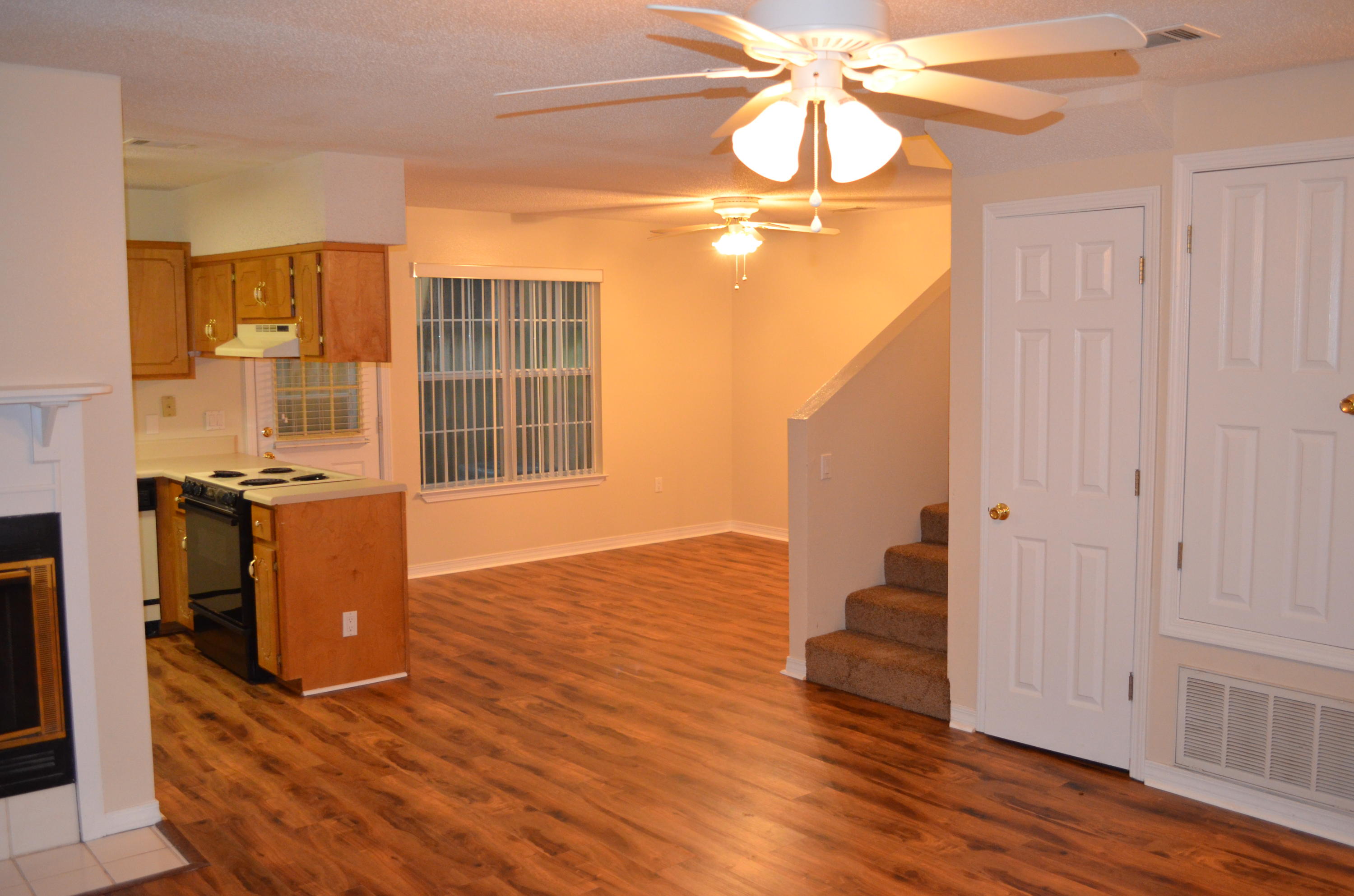 Three bedroom townhome with garage! Great room with brand new waterproof hardwood flooring through the downstairs (including the bathroom.) Living room has fireplace with mantle. Upstairs bedrooms have new carpet and both bathrooms have waterproof flooring. Open floor plan downstairs with dining area flowing into kitchen and living room. Townhouse located in the center of Fort Walton Beach. CATS ONLY ALLOWED WITH A $200 NON-REFUNDABLE PET FEE.