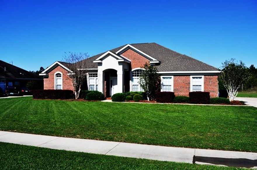 Immaculate Golf Course front home in Windswept Estates. This four bedroom, three bath ho0me is a well laid out three-way split floor plan, including formal dining and office. This home shows like a model. Recent updates include new carpet and wood flooring, stainless steel appliances, new lighting and plumbing fixtures, and new interior paint. The kitchen is open with easy access to both dining area's, and the family room with breakfast bar. The family room features beautiful distressed built-in shelving that encases the gas fireplace. This home has been meticulously maintained and sits on a well manicured .44 acre lot that backs to the 3 hole Par 5 at Windswept Estates Golf Course. There is definitely plenty of room for a pool. Schedule your showing today!