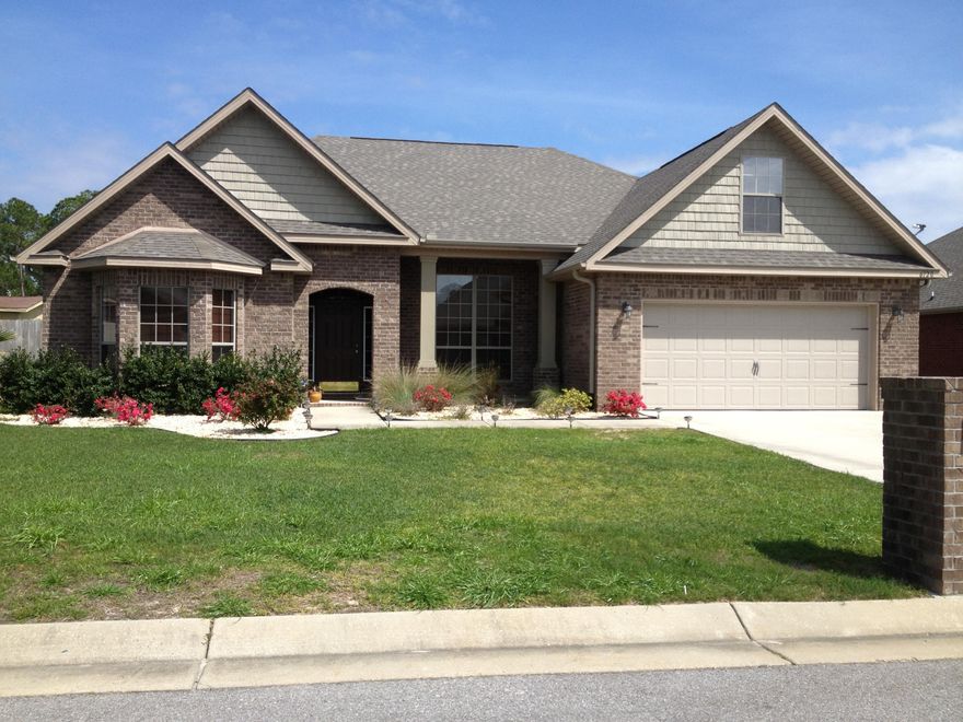 GORGEOUS INSIDE & OUT. Spacious open floor plan. Split bedroom design provides privacy for all. Huge family room is open to the formal dining room and the breakfast room. High trayed ceilings in dining room & master suite. Gourmet kitchen has ample granite countertop space with a raised snack bar. All kitchen stainless steel appliances included. Master suite has a separate 8'x8' sitting room, a bright master bath with dual vanities,a separate shower, garden tub & a large walk in closet. Family room and sitting room have exterior doors leading out to the covered rear porch great for relaxation. All bedrooms have their own return air to keep you cool and save you money - includes separate thermostat controls. Wired for security. Sprinkler System. GREAT FLOOR PLAN. GREAT LOCATION!!