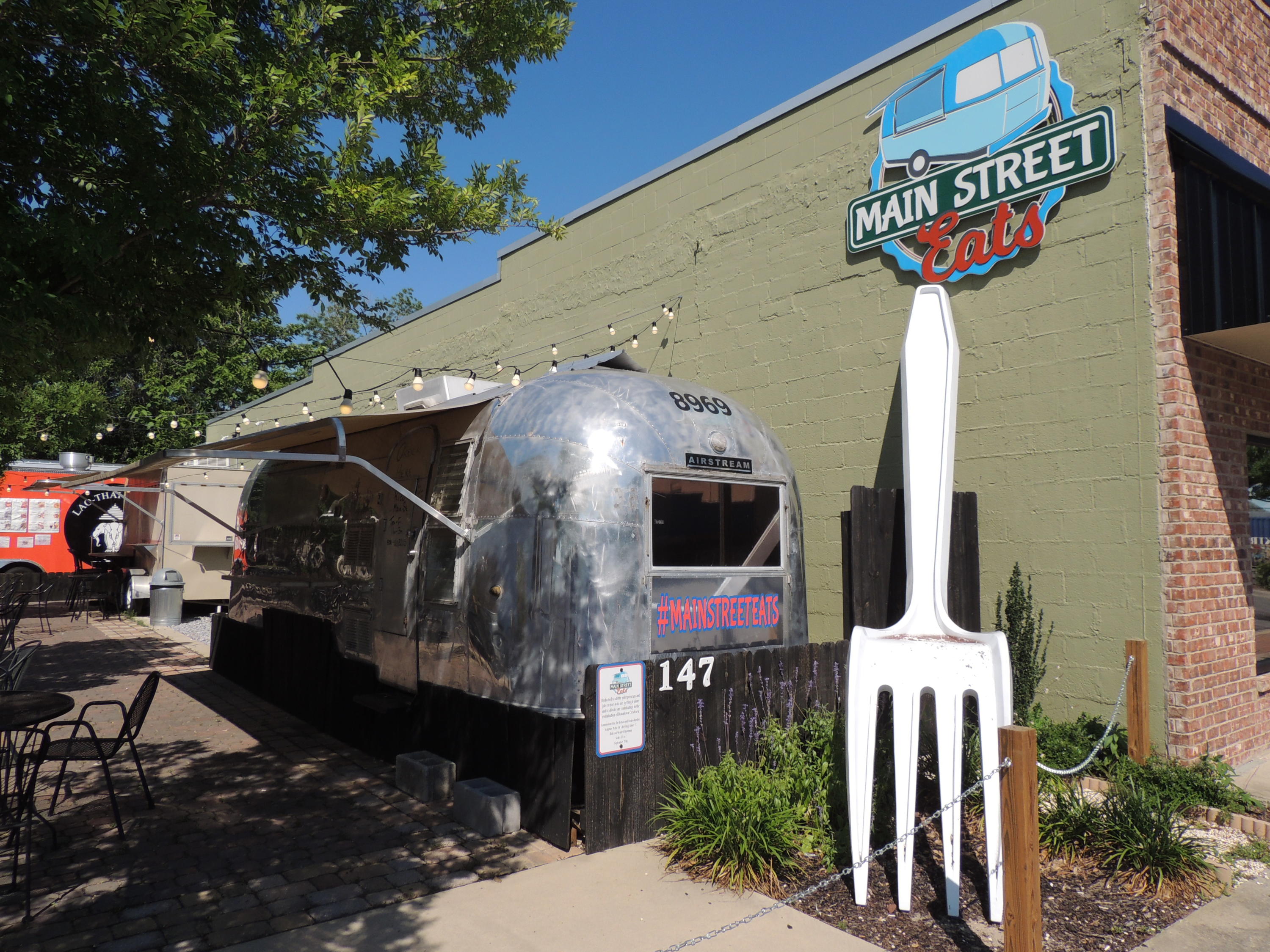 Established, turn-key food truck court - READY TO GO! Loyal customers have made this a local hotspot in Historic Downtown Crestview! One of the best parts about the scene at Main Street Eats is the unique personality and flavor that each truck brings. Patrons can enjoy outdoor dining at the patio tables, under the large umbrellas. The owners have focused on building out the lot the right way, so you can focus on building your business and living your dream - an investment for your future! Check them out at www.mainstreeteats.menu & www.facebook.com/MSECrestview. Purchase includes: fully equipped vintage Airstream, smaller food trailer suitable for soup/sandwich & cafe' style food production, Wi-Fi, 25'x100' lot with restrooms and utility room meeting all FL Health Code requirements.