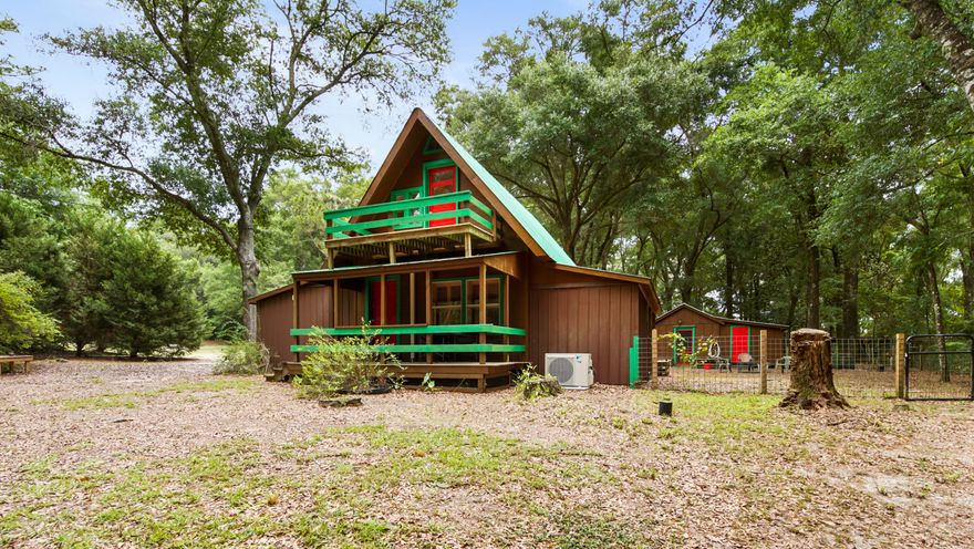 Nestled on 7.34 secluded, wooded acres, this unique 2-story cabin offers 3 bedrooms, 2 bathrooms, and 1,364 square feet. Perfect as a full-time residence or weekend escape, this property combines rustic charm with versatile amenities for a variety of lifestyles. Outdoor features include a dedicated dog training area, a dog agility training field, and a private pistol range. This is a rare setup ideal for animal lovers, trainers, and outdoor enthusiasts alike. With open acreage, wooded privacy, and room to expand, this property is full of opportunity. A private driveway leads to the home, where you'll find a carport and an additional detached building currently used as a storage area, and laundry room, offering incredible flexibility for homeschooling, workshops, or extra space. Walking distance to Ponce De Leon K-12. Whether you're looking to unwind in nature or create a multi-use homestead, this property delivers both peace and potential. Schedule your showing today and come experience the freedom of country living!