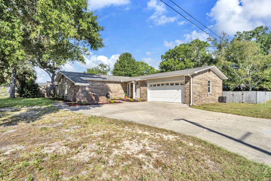 Completely updated 3BR/2BA brick home across from Cinco Bayou in the heart of Fort Walton Beach! Centrally located near military bases, shopping, dining, and top-rated schools. Major updates include: new 30-year dimensional shingle roof (2023), new hot water heater (2023), new A/C (2025), new LVT flooring, remodeled kitchen, and updated bathrooms.Interior features include two spacious living areas (one with fireplace, one with patio access), a galley kitchen with stainless appliances, granite countertops, tile backsplash, and wood cabinetry. The master suite offers a custom tiled shower with frameless glass, updated vanity, and modern fixtures. Guest bath features oversized vanity, tiled backsplash, updated lighting, and hardware. Additional upgrades include new light fixtures, shiplap accents, wainscoting, baseboards, raised panel doors, and 2" blinds.

Exterior highlights: privacy-fenced backyard, covered and open patios (wired for TV & fan), outdoor shower, storage shed, mature landscaping, two-car garage with built-ins, sink, and smart opener, plus extra parking pad.

Buyer to verify all dimensions and information.