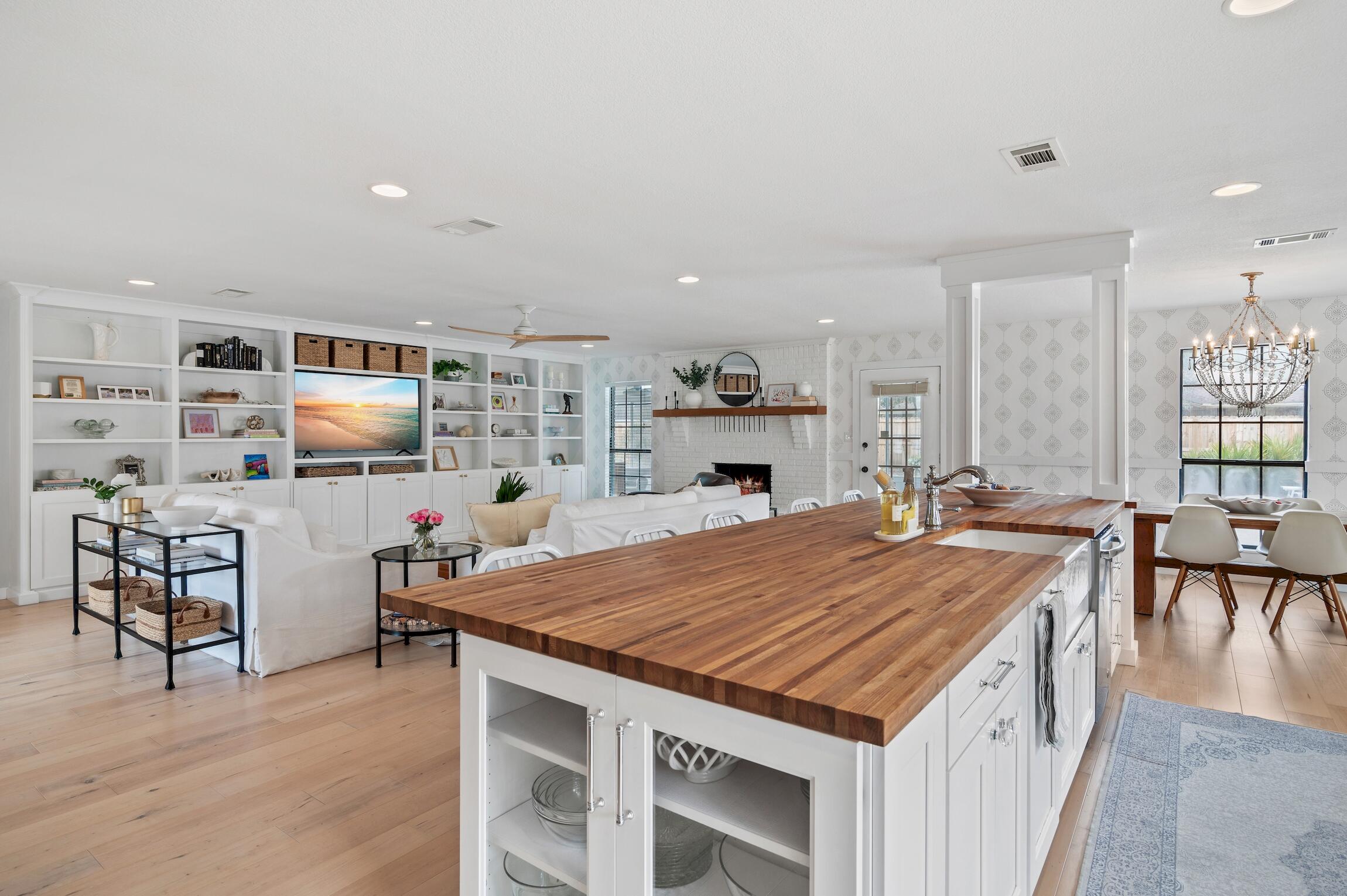 Welcome to your dream home in the sought-after Indian Bayou subdivision of Destin, Florida! Nestled in a serene neighborhood with charming sidewalks, a picturesque golf course, and waterfront homes nearby, this completely renovated gem awaits you. As you step inside, prepare to be captivated by the stunning transformation of this residence. Every detail has been meticulously attended to, boasting brand-new flooring, appliances, and exquisite lighting fixtures that illuminate the spacious interior. The heart of the home is the expansive kitchen, designed for both functionality and style. Featuring an oversized butcher block island, perfect for meal prep or casual dining, this kitchen is a culinary enthusiast's paradise. A large pantry ensures ample storage space. The primary suite features a large and the bathroom is adorned with designer Schumacher wallpaper for a touch of luxury. The ensuite bathroom creates a serene escape after a long day. Two additional bedrooms offer comfort and versatility, while the well-appointed guest bathroom ensures everyone's needs are met. The large laundry room adds a touch of flare with beautiful wallpaper from Thibaut - even the mirror is gorgeous from William Sonoma Home. The hardware throughout the home is Emtek. Outside, the expansive backyard beckons with endless possibilities. Whether you envision lush landscaping, outdoor entertaining areas, or a play haven for children and pets, this sizable lot provides the canvas for your imagination to flourish. Plus, with a two-car garage, there's plenty of space for parking and storage. The wood burning fireplace is a beautiful focal point. Living in Indian Bayou means enjoying the best of Destin living. You're just a short distance from pristine beaches, where days of sun, sand, and surf await. And don't forget about the delightful weekly food trucks stationed at the entrance of the neighborhood, offering a delicious array of culinary delights. BONUS - Solar panels are included with this home, making your utility bills super affordable!!! Don't miss your chance to make this impeccable residence your own.
