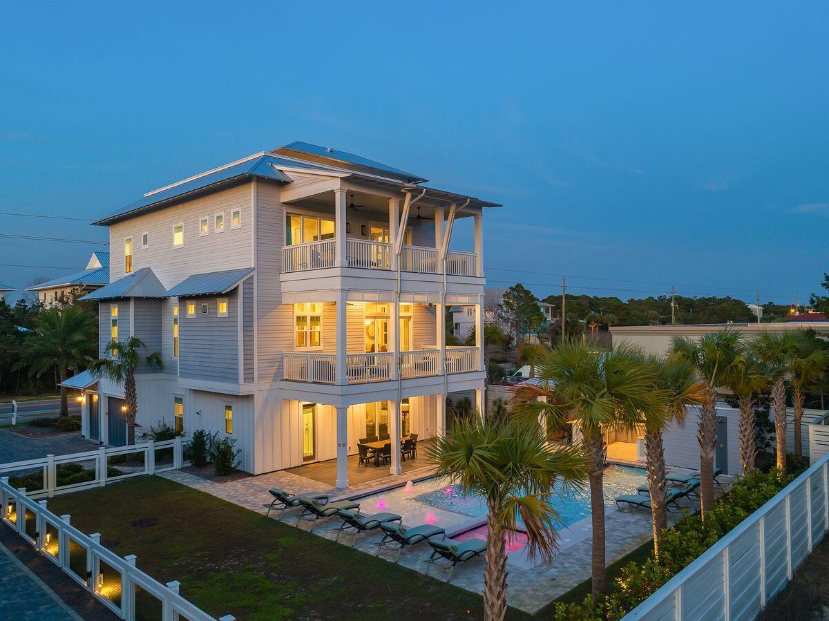 Masterfully built and thoughtfully designed, this exemplary construction built by Betterbuilt of Northwest Florida in 2018 is prominently situated on the west end of 30A and presides over an impressive elevation yielding unparalleled panoramic gulf and sunset views from the beautiful top floor open deck. Professionally rendered with coastal contemporary decor, this home was built as a legacy property, perfect for multi-generational living or as a top producing short term rental ($250K+ annual projected income) offering optimal accessibility from the private elevator which accesses all four levels as well as ample indoor and outdoor living spaces.