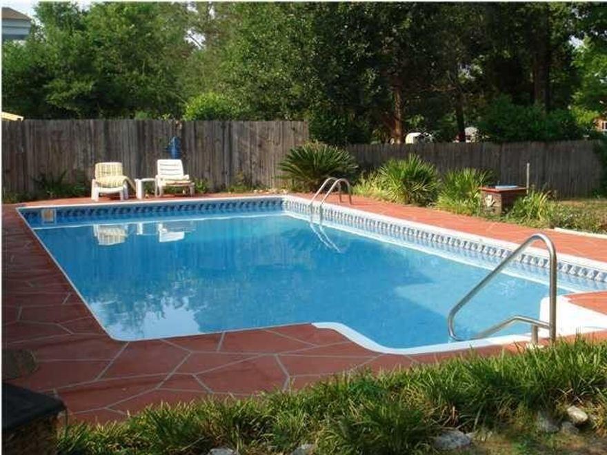 Enjoy the oversized 18 x 36 inground pool with a gorgeous scored concrete deck plus tons of impressive upgrades in this charming home. There is a 16 x 21  enclosed patio perfect for entertaining or relaxing. Custom tiled Jacuzzi tub & stand up shower as well as a wood burning fireplace are amongst the impressive extras. There's a combination of tile & pergo wood floors throughout the home. Also there's a fourth room which currently has no closet but can be easily added to make a fourth bedroom. Lots of possibilities so make an offer today! (Beautiful pics on the way)