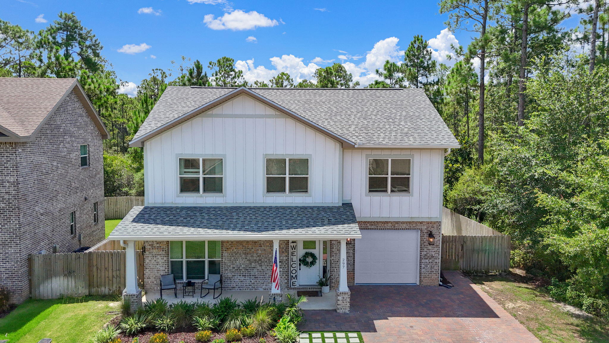 Welcome to this beautifully crafted two-story home in the sought-after Harstvedt Plantation neighborhood of Santa Rosa Beach. Designed with comfort and flexibility in mind, this custom-built residence offers four bedrooms, three and a half bathrooms, and a versatile bonus space perfect for extended living or guest accommodations.Bonus: The home offers an assumable VA mortgage at 4.625%--a rare opportunity in today's market--and a 1% buyer incentive to make your move even sweeter. Step inside to find durable luxury vinyl plank flooring throughout and an open-concept main living area that seamlessly connects the living room, dining space, and kitchen. A custom-built focal wall with an electric fireplace adds warmth and character, while the kitchen features a breakfast bar, ample cabinetry, and modern finishes.
The first floor also includes a flex room currently used as a home office, ideal for remote work or a quiet retreat. Upstairs, you'll find a spacious master suite with a walk-in closet and ensuite bath with double vanity and tiled shower, a convenient laundry room, and two additional bedrooms with a shared full bath. Above the one-car garage sits a fourth bedroom and additional bathroom in a bonus suite that can be seamlessly integrated into the main home or closed off with a separate entrance, perfect for a private guest suite, mother-in-law quarters, or potential rental income.
The fully fenced backyard includes a sprinkler system and offers room to relax or entertain with a raised deck and ambient lighting. Located in a charming neighborhood close to beaches, schools, shopping, and dining, this home combines comfort, function, and flexibility in a highly desirable location.