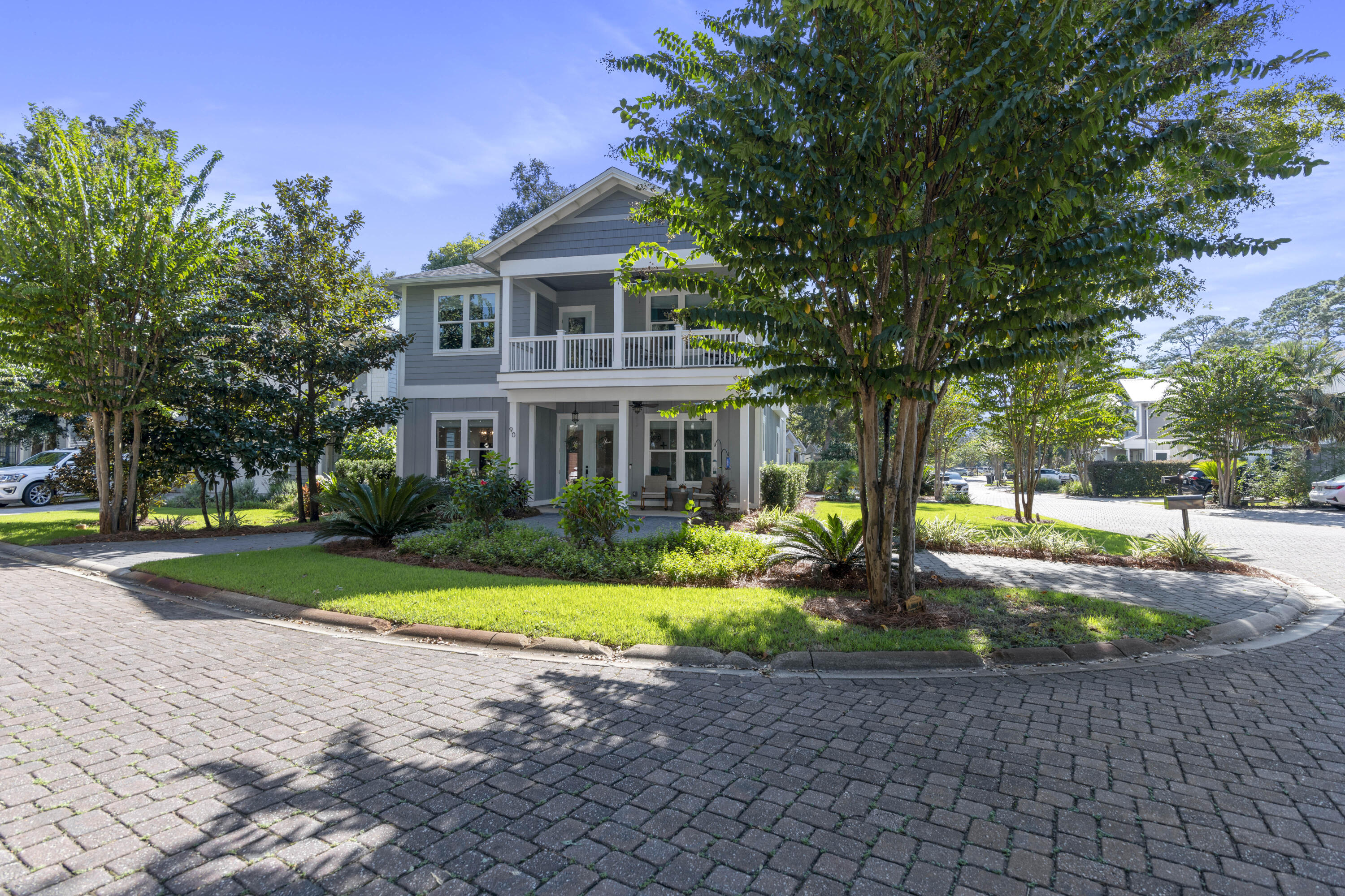 This custom-built 4br home offers a perfect blend of luxury and coastal living, located in the tranquil, non-rental waterfront community of Sacred Oaks in Santa Rosa Beach. Built in 2021, this exceptional residence sits on a corner lot and provides easy access to the bayou and bay, just 200 feet away from a community dock & park. Enjoy fishing, kayaking, paddle boarding and boating right outside your door. Majestic oaks, magnolias and pines line the paver stone roads giving a sense of peace and serenity. The home is designed for full-time living in mind offering great storage, a private garage, dual paver stone driveways for plenty of parking and additional boat storage behind double gates. On the main level, the open-concept floor plan creates a spacious and bright living & dining area! Luxury vinyl flooring & tile throughout allows easy maintenance and there has been true care with the home. The gourmet kitchen is a standout with Quartz countertops, stainless steel appliances, gas range with hood, a unique mosaic tile backsplash, ample cabinetry, and a breakfast bar. There is a dining area for size with contemporary lighting if you prefer a more formal setting. A bedroom with an ensuite bath featuring an intricate tile and glass walk-in shower, plus a half bath and large laundry room, are also conveniently located on this level. Outside, the large, covered front porch is perfect for enjoying the coastal views and the serenity of the surrounding trees. 

The upper level is equally impressive, offering a wet bar with a wine fridge and sink, along with the primary suite that boasts 10-foot ceilings, a shiplap accent wall, and barn doors leading to a spa-like ensuite bath with a soaking tub, dual showerheads, and Quartz double vanities. Elegant tile expands to the ceiling in the open shower both in the primary and the guest baths. Two additional guest bedrooms share a bathroom, and an expansive balcony with peaceful views of oak trees and the bayou offers the perfect retreat to unwind.

Additional features of this home include raised ceilings, remote-controlled window treatments, irrigation well, a concrete slab foundation, 2x6 construction, increased R value exterior insulation, soundproofed walls, storm rated windows, high-end fans and fixtures, added gutters with leaf guard, tankless hot water heater, outdoor shower and additional gas line for a summer kitchen or fire pit, if desired. Located just minutes from Grand Boulevard Towne Center, Sandestin Resort & Marina, and Topsail Hill State Park offering nature trails and one of the largest beaches, this home is an ideal opportunity for anyone seeking an upscale, coastal lifestyle in a non-rental community. 