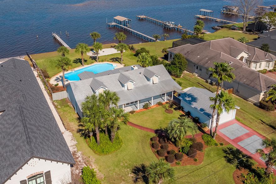 Waterfront paradise close to all that Destin & Sandestin have to offer. This updated 4 bdrm, 3 bth home boasts 100ft of water frontage along the Choctawhatchee Bay. The private pool, along with the charming sun room, makes for the epitome of Florida living. Enjoy the best fishing & unparalleled sunset views off of the dock & take in the lush landscapes surrounding the home. With custom features through out the interior, spending time inside this home will be just as enjoyable. Granite counter tops, custom floors & tile work, new cabinets, stainless steel appliances, pool pump, & custom fixtures have all been within the last 2 yrs. The detached 437sq ft. garage was also recently renovated & offers plenty of storage for your vehicles, water toys, & fishing gear.