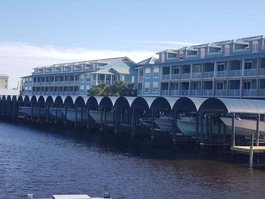 Beautiful, freshly renovated 1 bedroom 2 bath condo in Mexico Beach with covered BOAT SLIP. New everything, Appliances, landscaping, parking lot, boat slips, furniture, AC, light fixtures, plumbing fixtures, etc! This unit is better than new! This unique, custom floor plan sleeps 4 comfortably. The unit is sold fully furnished! Located on the canal this development is a favorite for serious boaters and fishermen. The Covered boat slip has running water and electricity and is large enough to accommodate approximately a 40' boat. This West End Harbour unit has 2 car covered parking with a large storage room perfect to store your gear, refrigerator and freezer. The Storage Room opens to the boat slips for quick, and easy loading. This location makes for easy access to the Gulf of Mexico.