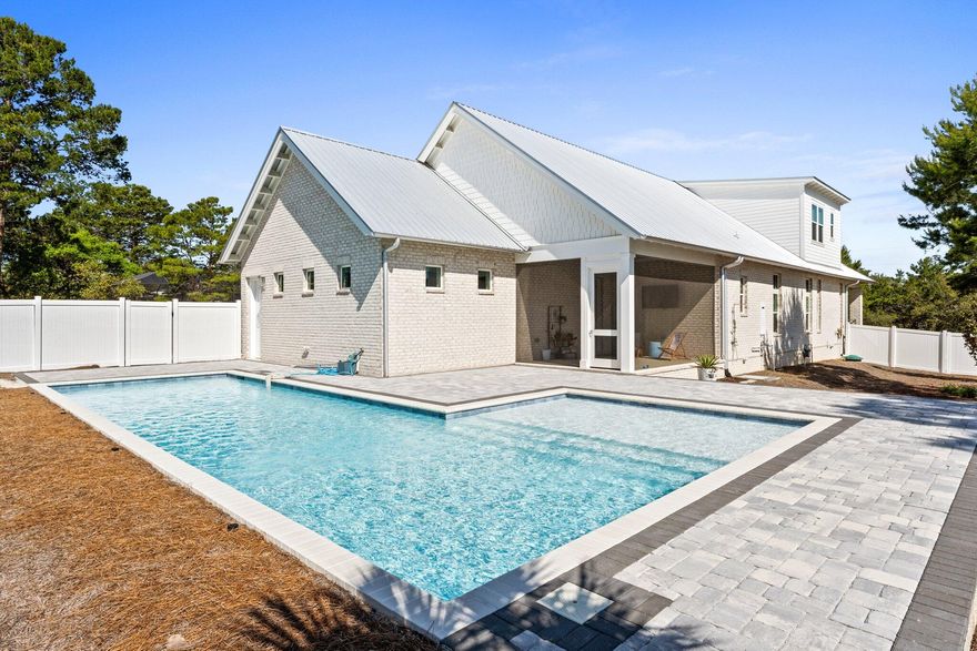 Tucked away in the quiet enclave of Santa Rosa Ridge on the west end of 30A, this custom-built residence offers an elevated coastal experience just moments from the beach and some of the west end's best restaurants. Set on an expansive private lot, the home blends refined craftsmanship with thoughtful design, creating a serene retreat equally suited as a full-time residence or luxury vacation escape. Beyond the inviting fa??ade, you'll find interiors marked by engineered oak floors, shiplap detailing, and curated tileworkall underscored by an abundance of natural light. The open-concept layout is anchored by a designer kitchen featuring quartz countertops, top-tier appliances, and a seamless flow into the main living spaces. Every detail has been considered, from the plantation shutters to the built-in bookcases and California Closets in the walk-ins.

An oversized screened porch opens to a private heated saltwater poolyour own secluded oasis ideal for slow mornings or entertaining under the stars. Additional amenities include a dedicated office, a generous laundry room with custom storage, and a garage that enhances everyday convenience.

Just a mile from the Beach Access, this home captures the essence of coastal luxury with timeless design and modern functionality. A rare opportunity in one of Santa Rosa Beach's most desirable communities.

Contact us today for cost-to-own figures & rental projections.