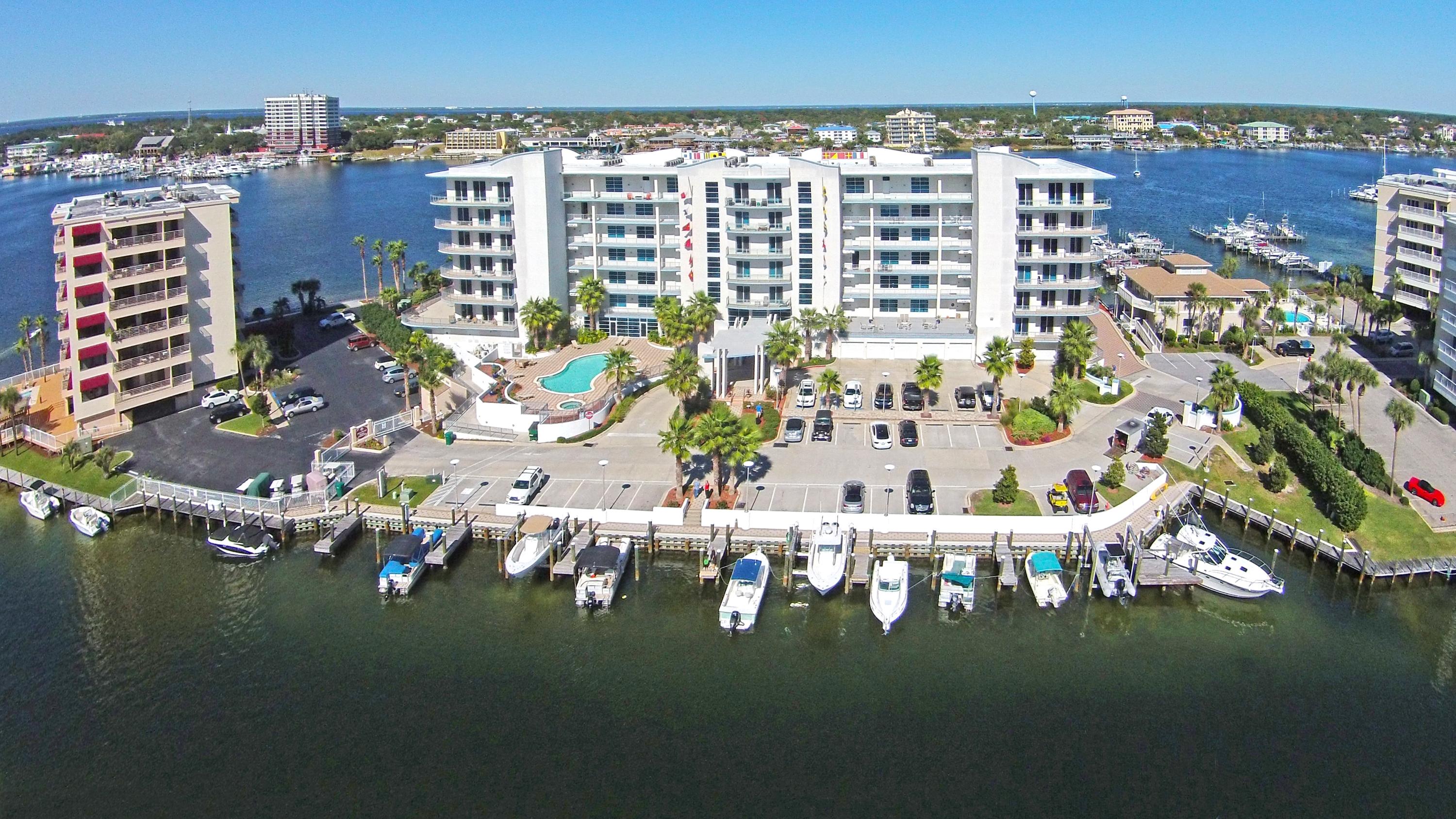 STUNNING CENTER STACK UNIT IN HARBOR LIGHTS, A BEAUTIFUL NEWER BUILT, PROMINENT 7-STORY CONDOMINIUM NESTLED ON THE DESTIN HARBOR WITH LUXURIOUS AMENITIES AND PANORAMIC HARBOR, PASS & GULF VIEWS. COVETED CENTER STACK UNIT OFFERS EAST & WEST ELEVATOR ACCESS PLUS PRIVATE BALCONIES (CLEAR GLASS PANELS TO ALLOW UNOBSTRUCTED VIEWS OF THE HARBOR) OFFERING AN ARRAY OF SUNRISE AND SUNSET VIEWS. THIS 3BR/3BA UNIT COMES WITH A CLIMATE CONTROLLED 1-CAR GARAGE #30, STORAGE ROOM #34 & A 16x16 BOAT SLIP #9 IS NEGOTIABLE. THIS PROPERTY IS IDEALY SITUATED AND YOU WILL BE IMPRESSED FROM THE MOMENT YOU STEP FOOT ON THE GROUNDS. ONCE YOU PASS THROUGH THE LUSH ENTRANCE TO THE PROPERTY, YOU WILL SEE THE GREAT DETAIL OF THE EXQUISITE LANDSCAPING. THE ENTRY LOBBY IS A BEAUTIFUL 2-STY