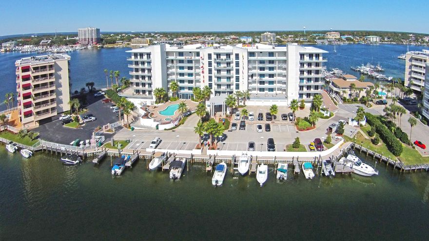 STUNNING CENTER STACK UNIT IN HARBOR LIGHTS, A BEAUTIFUL NEWER BUILT, PROMINENT 7-STORY CONDOMINIUM NESTLED ON THE DESTIN HARBOR WITH LUXURIOUS AMENITIES AND PANORAMIC HARBOR, PASS & GULF VIEWS. COVETED CENTER STACK UNIT OFFERS EAST & WEST ELEVATOR ACCESS PLUS PRIVATE BALCONIES (CLEAR GLASS PANELS TO ALLOW UNOBSTRUCTED VIEWS OF THE HARBOR) OFFERING AN ARRAY OF SUNRISE AND SUNSET VIEWS. THIS 3BR/3BA UNIT COMES WITH A CLIMATE CONTROLLED 1-CAR GARAGE #30, STORAGE ROOM #34 & A 16x16 BOAT SLIP #9 IS NEGOTIABLE. THIS PROPERTY IS IDEALY SITUATED AND YOU WILL BE IMPRESSED FROM THE MOMENT YOU STEP FOOT ON THE GROUNDS. ONCE YOU PASS THROUGH THE LUSH ENTRANCE TO THE PROPERTY, YOU WILL SEE THE GREAT DETAIL OF THE EXQUISITE LANDSCAPING. THE ENTRY LOBBY IS A BEAUTIFUL 2-STY