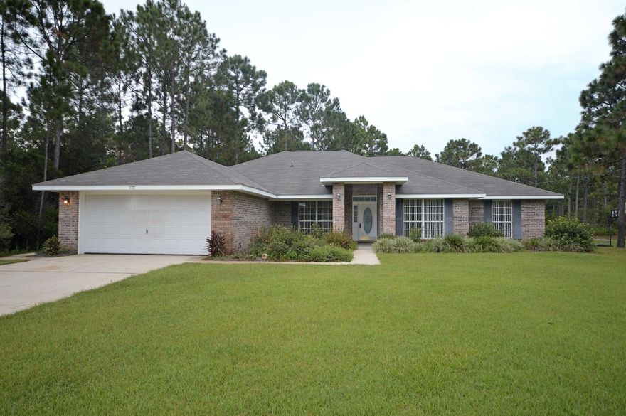 All brick 2281 sq. ft. 4 bedroom, 2 bath home with IN-Ground POOL and lanai sitting on .46 acres in Holley by The Sea Lifestyle community. The home features split and open floor plan, stainless steel appliances, granite countertops, tile, smoothtop range; 3 bedrooms split from the master bedroom. Home features dining area and formal dining area with office. Features a fireplace, sunporch, and enclosure around and over the in-ground pool.The property sits on a lot protected on two sides from neighbors, quiet and private. The home has a lawn pump, sprinkler system, pull down storage, landscaping native to Florida and bird feeders for owners who love the outdoors. Priced for a quick sale with features. Will install new padding & carpet of your choice. Make this a quick must see home