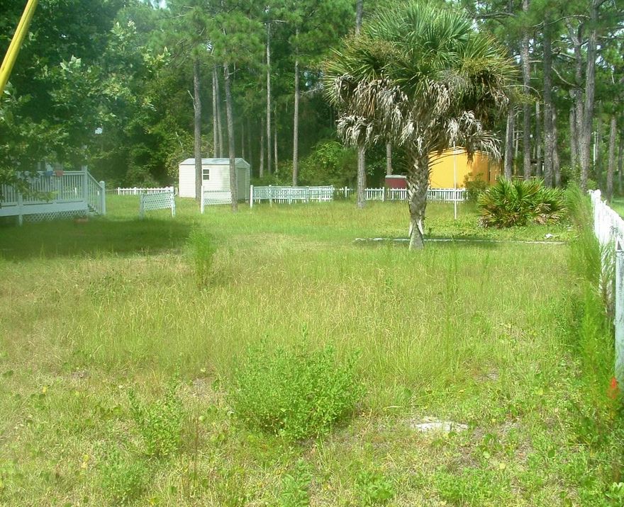 Corner lot, cleared and fenced. Lot is just north of Hwy 30A. No HOA, no restrictions. Subdivision is located just east of Seaside and has a deeded beach access. Survey is available. This lot is high and dry and ready to build on.