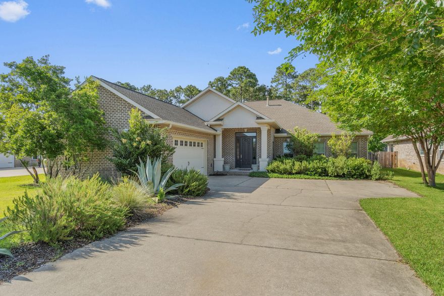 Welcome home to Florida living at its finest! This stunning custom-built 5-bedroom, 3-bathroom home is truly exquisite inside and out, perfectly situated in the sought-after waterfront community of Heritage Park--a private gated neighborhood located along the beautiful Santa Rosa Sound. Residents enjoy a charming entrance with vintage-style lighted cobblestone street, curbed sidewalks, ornate mailboxes, underground utilities, and a waterfront clubhouse that captures the very best of coastal living. Elevated to take full advantage of panoramic views of Santa Rosa Island, the clubhouse features a saltwater pool, fitness center, conference room, lounge with TV, and a fully equipped kitchen. A large common green space leads to deeded access to the beach and sound, and a scenic community pier-- perfect for watching sunsets and soaking in the serene Gulf breeze.
This 2,870 sq ft home is ideally located within minutes of the clubhouse and water access. The beautifully landscaped front yard features manicured borders and mature trees, while the fully fenced backyard offers a covered porch, ideal for outdoor dining and enjoying peaceful Florida evenings. The home greets you with a courtyard entrance and spacious covered porch. Inside, the large foyer provides a grand welcome and leads to a mudroom and the versatile fifth bedroom or home office. Down the hallway, the home opens to a stunning great room with soaring ceilings, crown molding, and a focal point fireplace with ornate surround. French door opens to the backyard, while a charming nook with built-in seating and hanging space adds functional flair.
The breakfast area offers views of the garden and flows into a gourmet kitchen featuring tall cabinetry, granite countertops, stainless steel appliances, wall-mounted oven and microwave, a gas cooktop with extractor, and an undermount sink. The center island adds more storage, and a sleek top breakfast bar is ideal for busy mornings. The master suite is a true retreat with trey ceilings, crown molding, and floor-to-ceiling windows overlooking the backyard. The luxurious ensuite includes a soaking tub with tile surround, seamless glass walk-in shower, extended double vanity, and a large walk-in closet with built-in shelving.
Three additional guest bedrooms are generously sized with double closets. Two bedrooms share a spacious bathroom with double vanity, linen closet, and a tub/shower combo, while the third enjoys its own bathroom with a full vanity and large step-in shower.The utility room off the hallway provides extra storage and a laundry sink. Throughout the home, you'll appreciate the thoughtful craftsmanshiphigh ceilings, deep baseboards, recessed lighting, and elegant finishes that enhance the custom design.
Located on the desirable east side of Navarre, Heritage Park offers convenient access to local shopping, dining, and the Navarre Beach bridge. Just a short 10-minute drive from the gates of Hurlburt Field, this exceptional home is perfectly positioned for those seeking luxury, comfort, and the best of coastal Florida living. Drone footage available to showcase the beauty and locationcall today to schedule your private tour!

