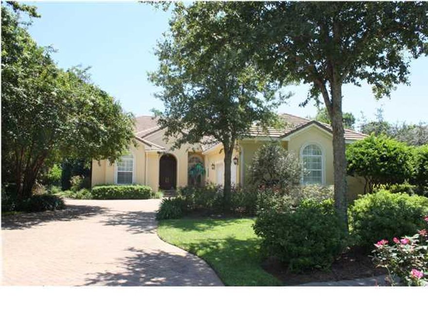 No flood insurance required! Seller has LOMA letter in hand! Backing to the nature preserve for the utmost in privacy is this absolutely gorgeous three bedroom, two bath custom home featuring arched mahogany entry doors, travertine floors, raised ceilings, deep crown molding, designer lighting, custom built-in and so much more! The formal living room is to the right of the foyer and a handsome library, complete with a wall of custom built-ins, is to the left. Cozy formal living room has a gas fireplace, a wall of stacked sliding glass doors opening to the covered lanai and screen enclosed pool and spa, and a wet bar that is also accessible from the kitchen. Everyone will love gathering in the open kitchen/leisure/casual dining area! The kitchen has a large island with granite