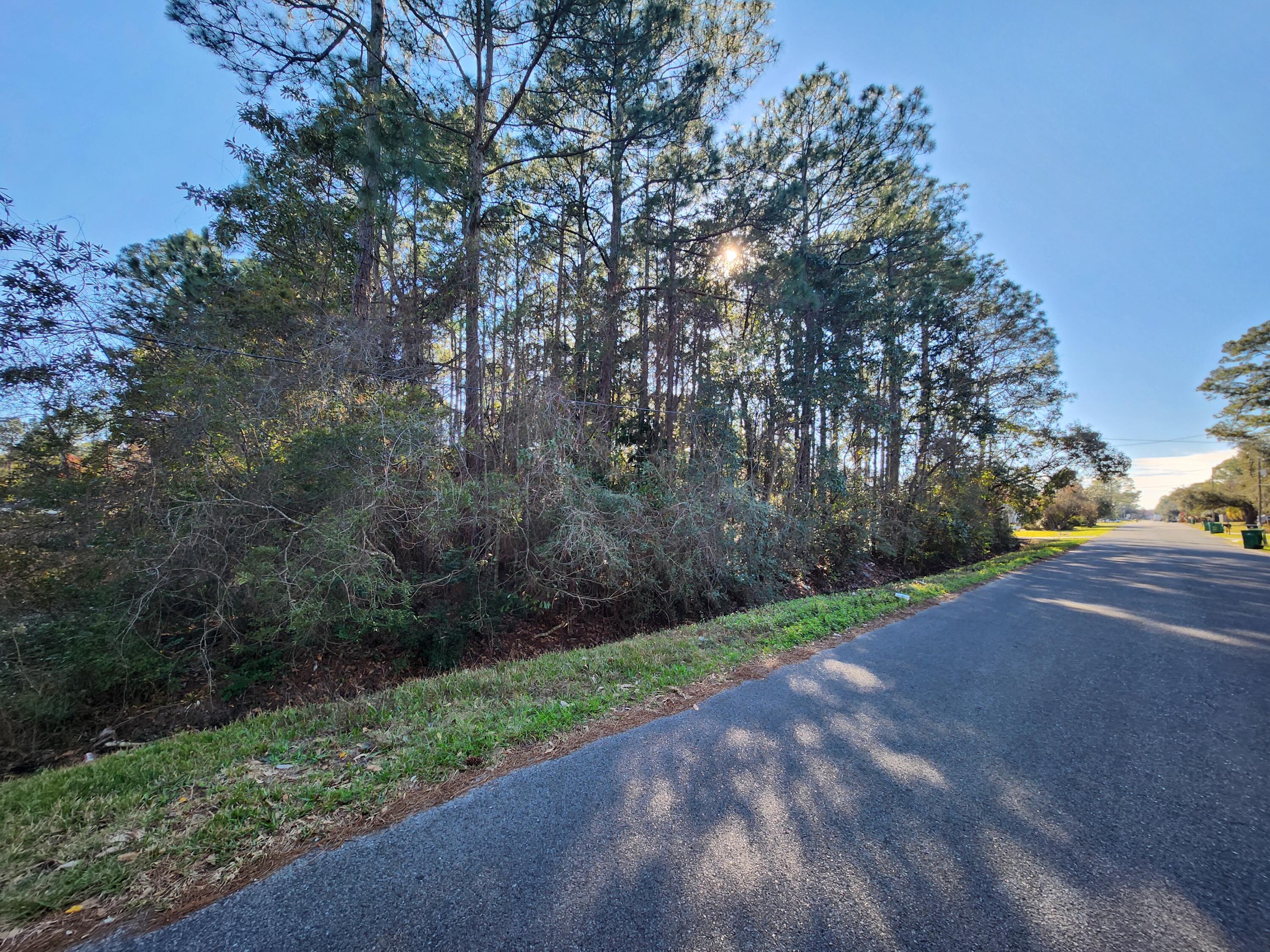 .23 acre lot in close proximity to Hurlburt. Raw lot zoned R-1 Utilities at the road, tap in fees are due. According to GIS map, flood zone X, no wetlands (NO study has been conducted), see photos for other pertinent information according to county GIS map. Owner will consider all offers. According to county zoning R1 allows Single-family, mobile/manufactured homes, see docs for more SETBACKS F 20ft B 10F sides 10ft. Adjoining lot is also available MLS #969872