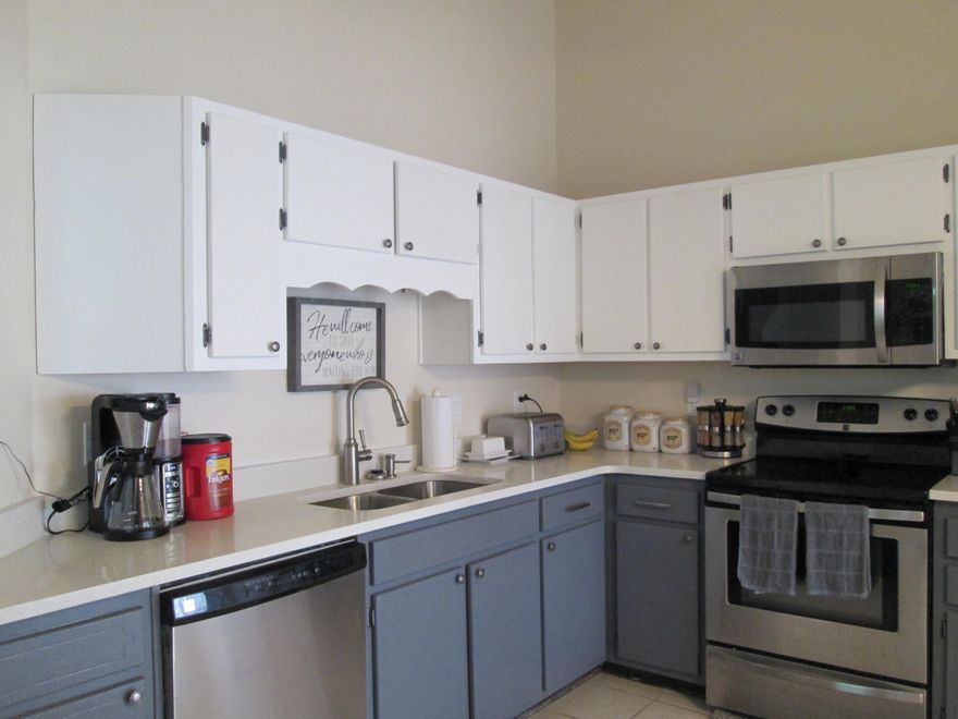 This Navarre home will leave a lasting impression with its charm and modern updates throughout! As you pull up to the home, you are greeted with a 1-car garage and a distinctive pitched roof. The siding is a combination of brick and vinyl, which adds some great curb appeal. As you enter the home, you are greeted by a grand cathedral ceiling in the living room. The living room also boasts a cozy fireplace and large windows that bring in a lot of natural light. For your peace of mind, the HVAC system has been replaced (May 2017) and windows have been replaced as well (Dec 2017). All 3 bedrooms feature new carpeting (Feb 2017). As you make your way into the kitchen, you will notice the new stainless-steel appliances (Jan 2017) and quartz countertops.