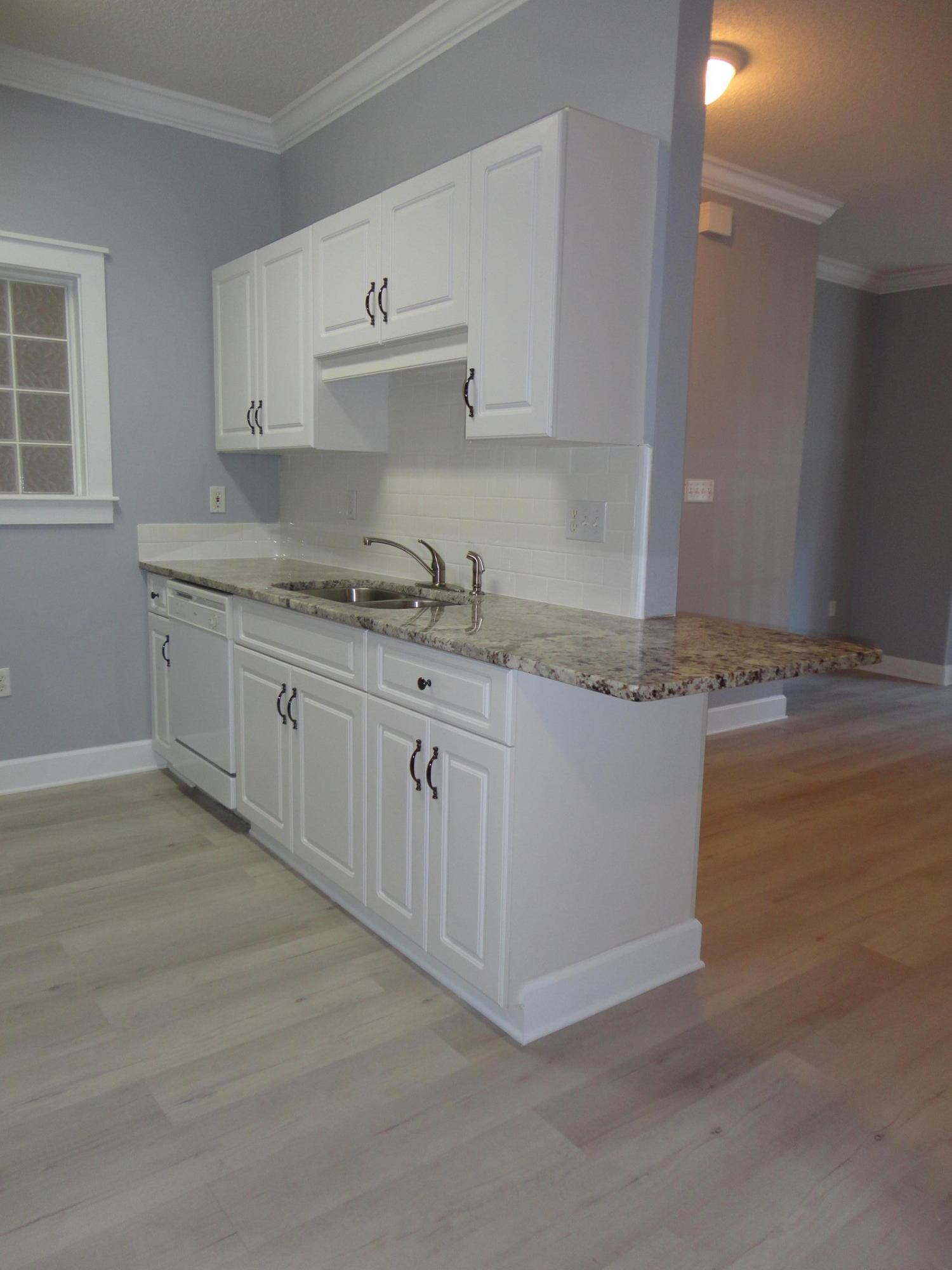 NEWLY UPDATED two bedroom two bath unit in The Oaks in Niceville. New LVT flooring, trim, paint, lighting and granite counters and appliances. The Oaks Condominium boast a common pool and multiple grill areas, its within close proximity to Ruckel Middle School and Niceville High School as well as Eglin AFB. Partin Drive is an arterial route that connects directly to Highway 20 south and I-10 to the north and the Beaches of Destin and South Walton are approximately 15-20 minutes via the Spence Parkway Bypass and the Midbay Bridge. This unit has two assigned parking spaces. Its well maintained with some upgrades including wood flooring, crown molding, window trim and fresh paint. These units are great for an end user or investor. Check this unit out.