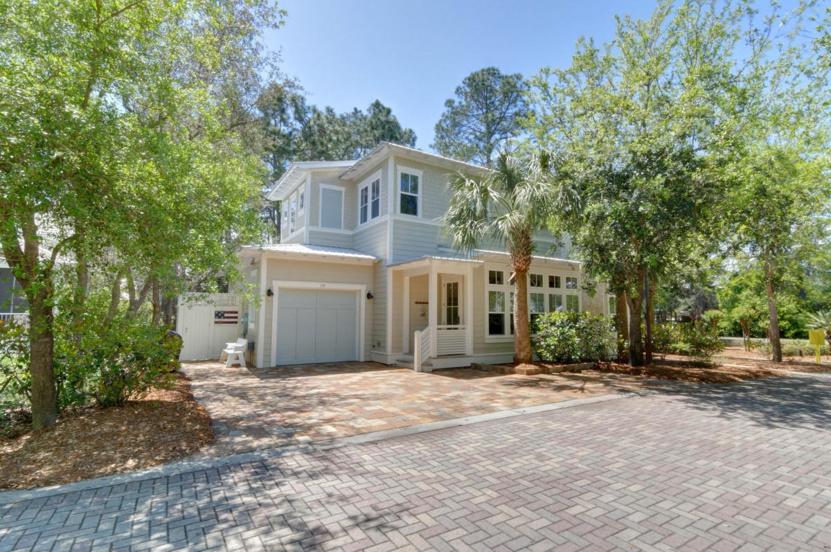 Pending with Contingency - Accepting Backup Offers. South of 30A! Cottages at Eastern Lake is a small exclusive community in Seagrove Beach. Relax on the front porch of this beautiful custom family beach house. Open concept kitchen and living area. Bright and airy with lots of windows and high ceilings. Gorgeous maple wood floors throughout. Four bedrooms each with en-suite bathrooms plus guest bathroom off living area. Comes fully furnished. Move right in or start your rental investment immediately. Large outdoor cold/hot shower for rinsing off after a beach day. Garage for car or golf cart and storage. Amazing resort style pool in this quaint cottage community. Short walk to the white sand beach and amazing blue water. Great family home or investment property.