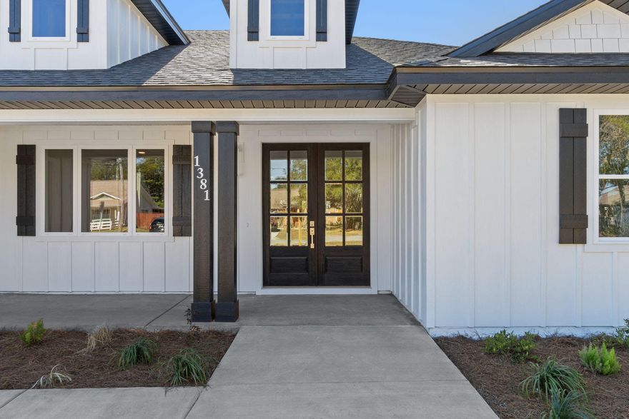 Welcome to one of the largest lots available in Holley By The Sea. Bigger than your average lot size! This custom built home is situated on .72 acres of high and dry land. Irregular shaped lot gives you plenty of trees, privacy, and space for the workshop, shed, and pool someday! You will love the sidewalks out front that are brand new. Many areas don't have this feature at all. The home is within a short distance of the newest school, East Bay K-8 for your children. Ride or walk to school if needed! Once you pull up to this Craftsman home, you will notice a raised elevation leading up to the double vehicle garage and a sidewalk leading to the double 8' solid wood / glass doors. The grand entrance leads you into the formal living room that opens up to the dining and oversized kitchen. The custom cabinets are soft shutting, natural wood tones mixed with a bold color statement island piece! 
The deep kitchen sink looks right out the back window to view nature and also your oversized 27' patio with double fans. Your master bedroom also has a door leading out to the patio to enjoy those wine nights or those morning coffee Sundays. 
The kitchen has a staggered kitchen layout to show depth and detail of a kitchen you will love to cook in. Plenty of deep drawers as well for storage. The frosted glass is a beautiful feature for your deep pantry (with no wire shelving) 

One of your favorite features will certainly be your walk in shower. The builder chose high end finishes to make you feel like you are at a spa day, every day! The trendy patterns of the tiles reach the tall ceilings and enclosed with tempered glass. The spare bathroom is equivalent in class & style. The deep soaker tub is one of the best for your guests or children. There is a large upgraded tile that reaches the ceiling and the black vanity is a bold statement. 

The fixtures throughout the home are trendy as well. The windows are oversized to let natural light pour in, and the ceiling height is 9' with a knockdown finish. 
There is LVP throughout the home for a seamless finish. If a large laundry room with storage is one of your must-haves, you will LOVE this design. The builder kept your needs in mind! There are custom wood shelves and cubbies in the laundry room. Plenty for storage or to use as a mud room as you come in from the garage. 

Honestly this will be one of the best deals on the market. The average lot is a half acre in HBTS and this one is giving you .72 acres! Along with high end finishes, hardi board exterior, architectural shingles, landscaping, deep well with irrigation, and 4 nicely sized rooms with 2.5 bathrooms. 
We would love to work with you, so set up a PRIVATE TOUR TODAY and see if this is THE ONE! 
