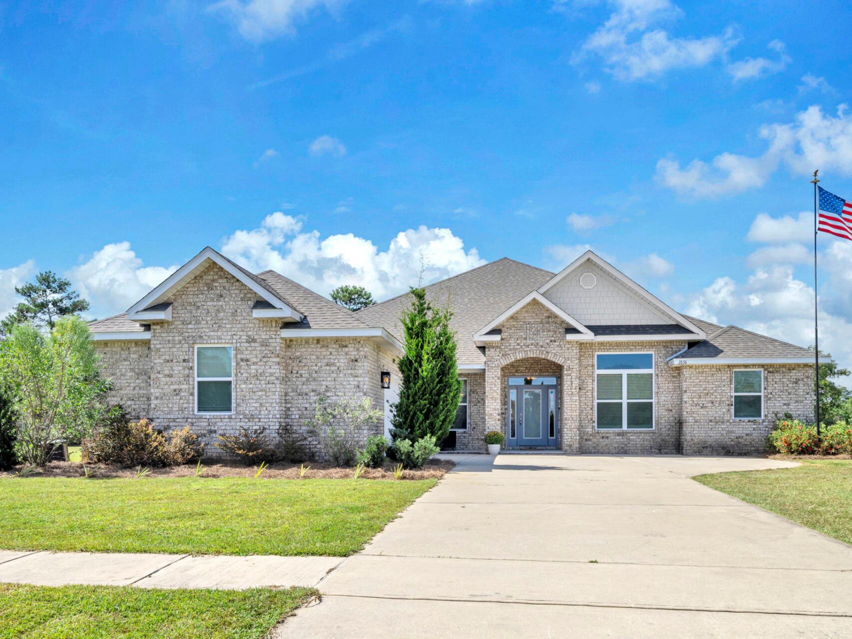 Welcome to the gated golf course community of Windswept Estates! This impressive all brick home sits on a prime tree-lined corner lot spanning over 3/4 acre. Soaring 12' ceilings, crown molding, and a double wall oven set this home apart from new construction options. Quartz countertops elevate the open concept kitchen. Epoxy flooring upgrades the 2 car attached garage. The thoughtfully designed, expansive 3400+ sf floorplan encompasses 4 BR plus a flex/office space. You'll love the Primary Suite with its oversized walk-in closet and an ensuite bath with double vanities, garden tub, and walk in shower. An additional bedroom also has an ensuite bathroom. One full bathroom has access to the patio and would make an ideal pool bathroom in the future. Come home to a quality built estate located in a beautiful golf-cart friendly community with its own pool, clubhouse, golf course, and tennis courts.