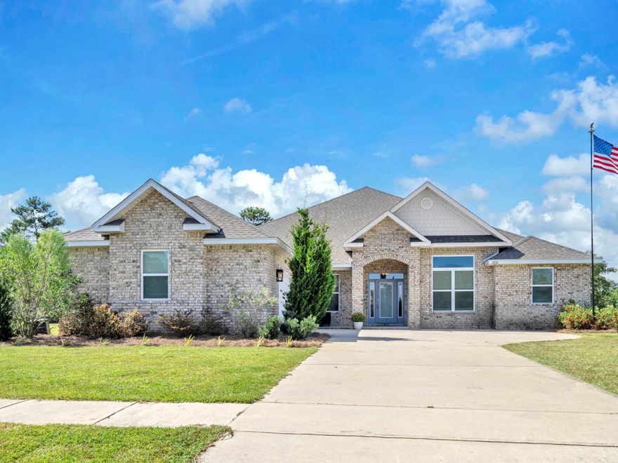 Welcome to the gated golf course community of Windswept Estates! This impressive all brick home sits on a prime tree-lined corner lot spanning over 3/4 acre.  Soaring 12' ceilings, crown molding, and a double wall oven set this home apart from new construction options. Quartz countertops elevate the open concept kitchen. Epoxy flooring upgrades the 2 car attached garage. The thoughtfully designed, expansive 3400+ sf floorplan encompasses 4 BR plus a flex/office space. You'll love the Primary Suite with its oversized walk-in closet and an ensuite bath with double vanities, garden tub, and walk in shower. An additional bedroom also has an ensuite bathroom. One full bathroom has access to the patio and would make an ideal pool bathroom in the future. Come home to a quality built estate located in a  beautiful golf-cart friendly community with its own pool, clubhouse, golf course, and tennis courts.