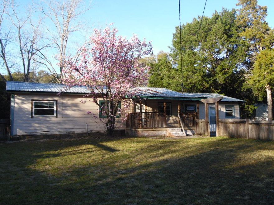 Four bedrooms and two bathroom home set back on a very spacious lot! The master bedroom could easily pass as second living area such as a family room with its own entrance. Some updating has been done, but this home still needs some TLC. The front and back yards are fenced, and the long driveway has plenty of room to park! Home to be sold ''AS IS''.