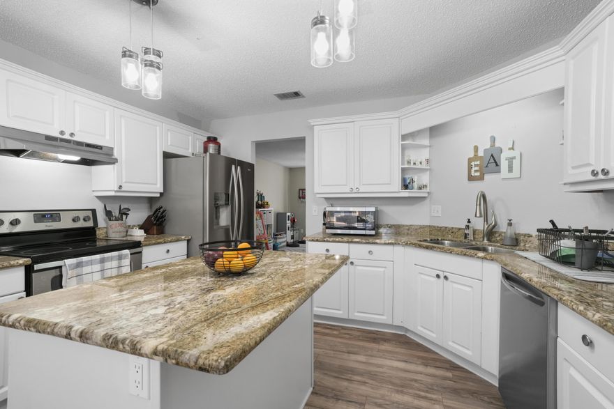 2.25% VA Assumable Loan, view this fully updated all-brick home in South Crestview! This spacious 4-bedroom, 2-bathroom gem also includes a charming bonus sunroom with rustic barn doors, a formal dining room, and nearly 2,400 square feet of living space. With a flat, fully fenced backyard, this home offers both beauty and practicality. Enjoy peace of mind with a dimensional shingle roof replaced in 2016 and a brand-new HVAC system installed in 2023. As you step inside, you'll immediately notice the updated flooring and open-concept, split floor plan. The expansive living room features a cozy fireplace, perfect for relaxing or entertaining. The kitchen is a chef's dream with updated granite countertops, modern lighting, sleek stainless steel appliances, and a spacious eat-in area