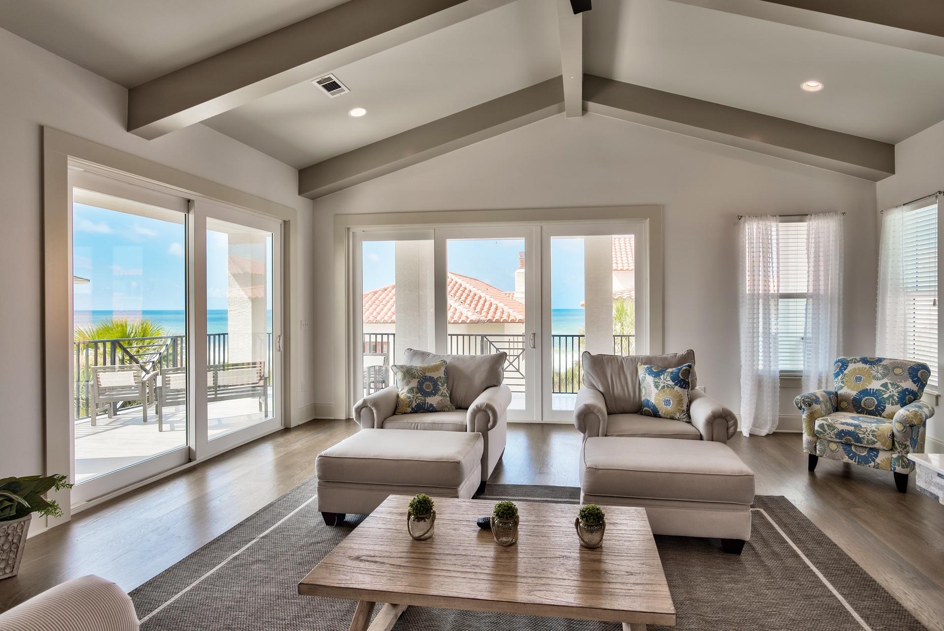 Phenomenal, corner home with breathtaking views & additional privacy located on the east end of the community. This is an exceptional Gulf view end lot just one tier back from the Gulf with easy access to the private beach boardwalk. The main living area and kitchen is positioned on the top floor to maximize the Gulf views and features elegant stained oak flooring. Craftsman touches like the custom beams & cathedral ceilings create a beautiful spacious setting. Enjoy an expansive oversized wraparound balcony with 13 ft depth - a true extension of the home & perfect place to take in the Gulf views, relax, dine & entertain! Beautiful and classic Mediterranean architecture set the tone reminiscent of a quaint, coastal European town. Escape to luxury beach living at Vizcaya!